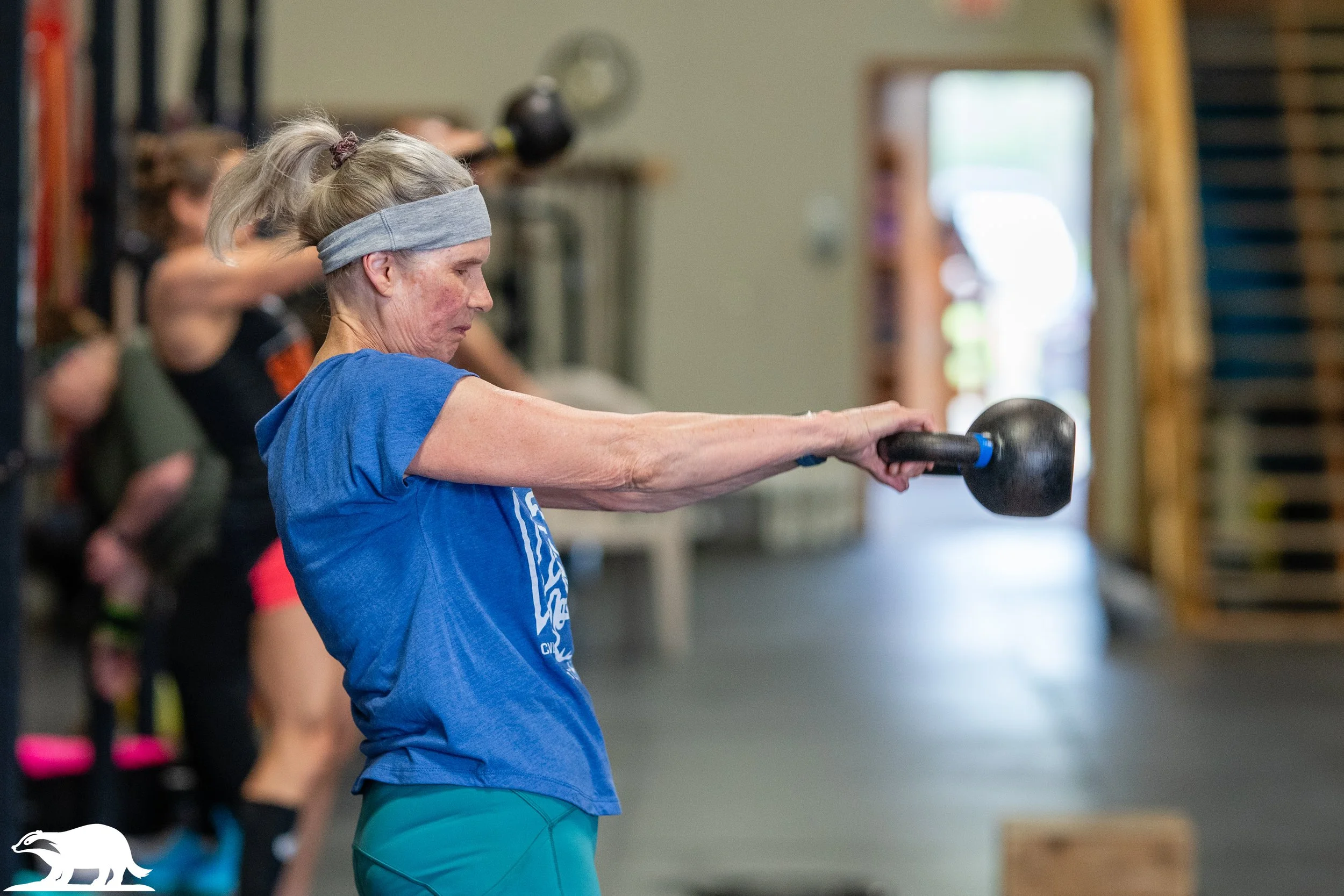 woman kettlebell swings
