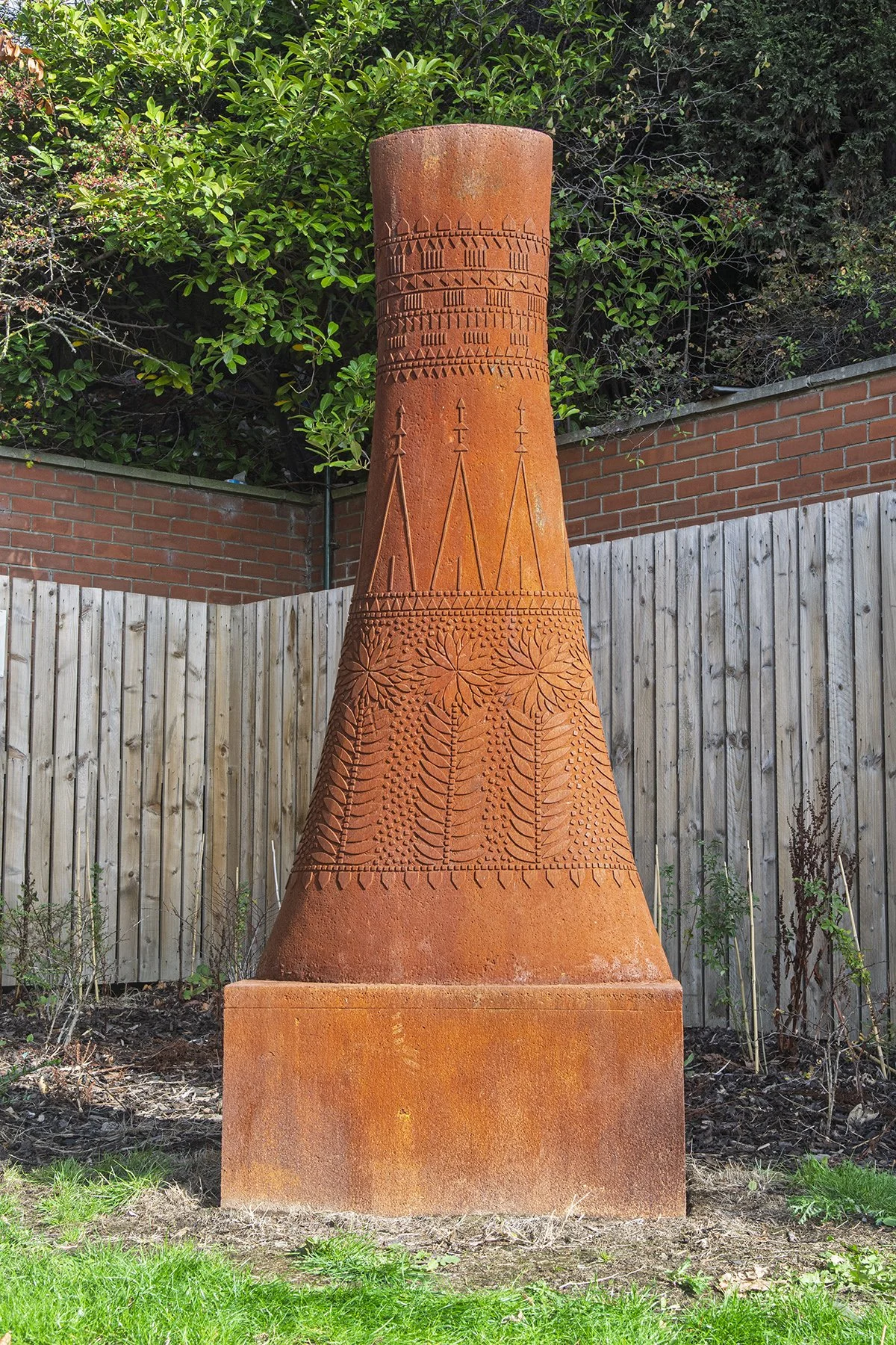 Cooling tower in nature's fabric.