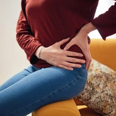 Woman with hip pain and stiffness