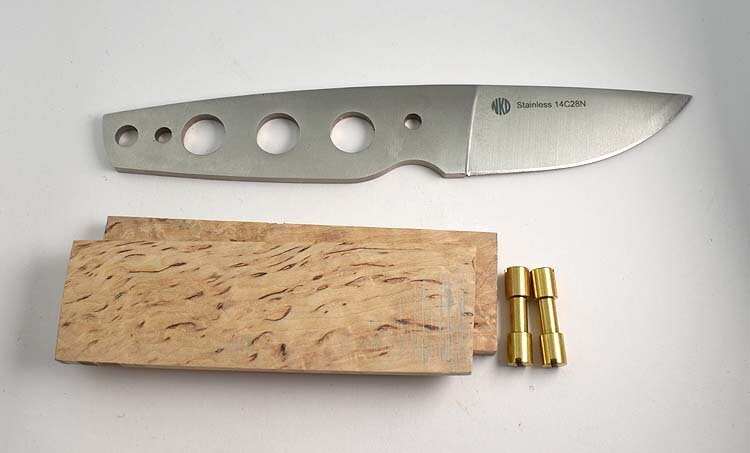 NKD beaver blade, flat ground curly birch, thickness 7 mm and corby rivets.