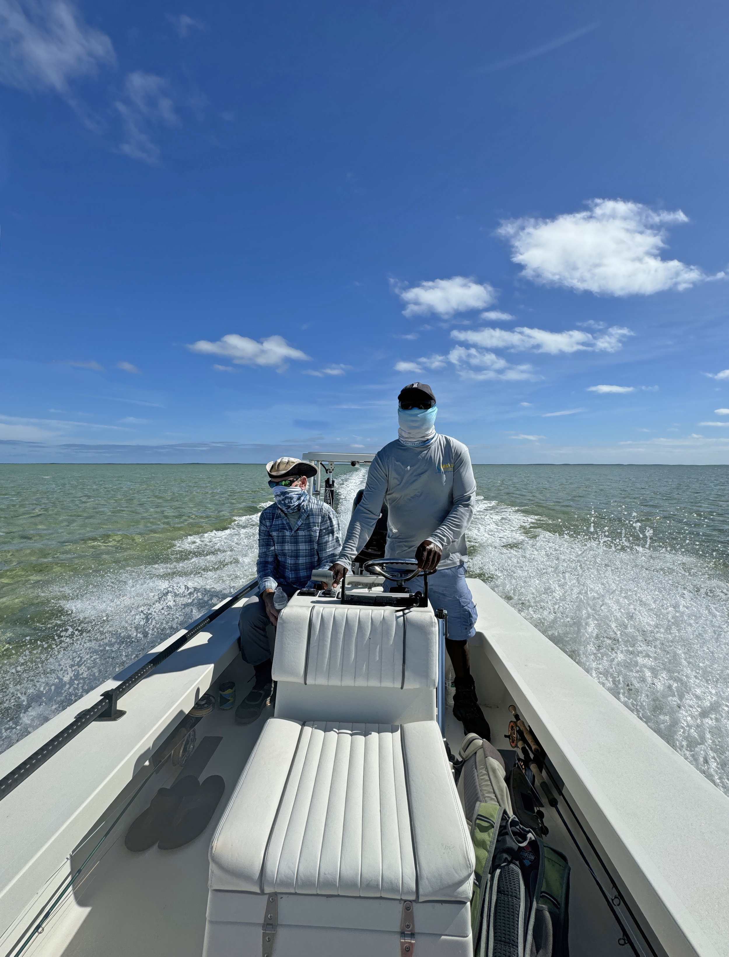 Flats skiff, flat bottom, poling a boat, Bahamas.