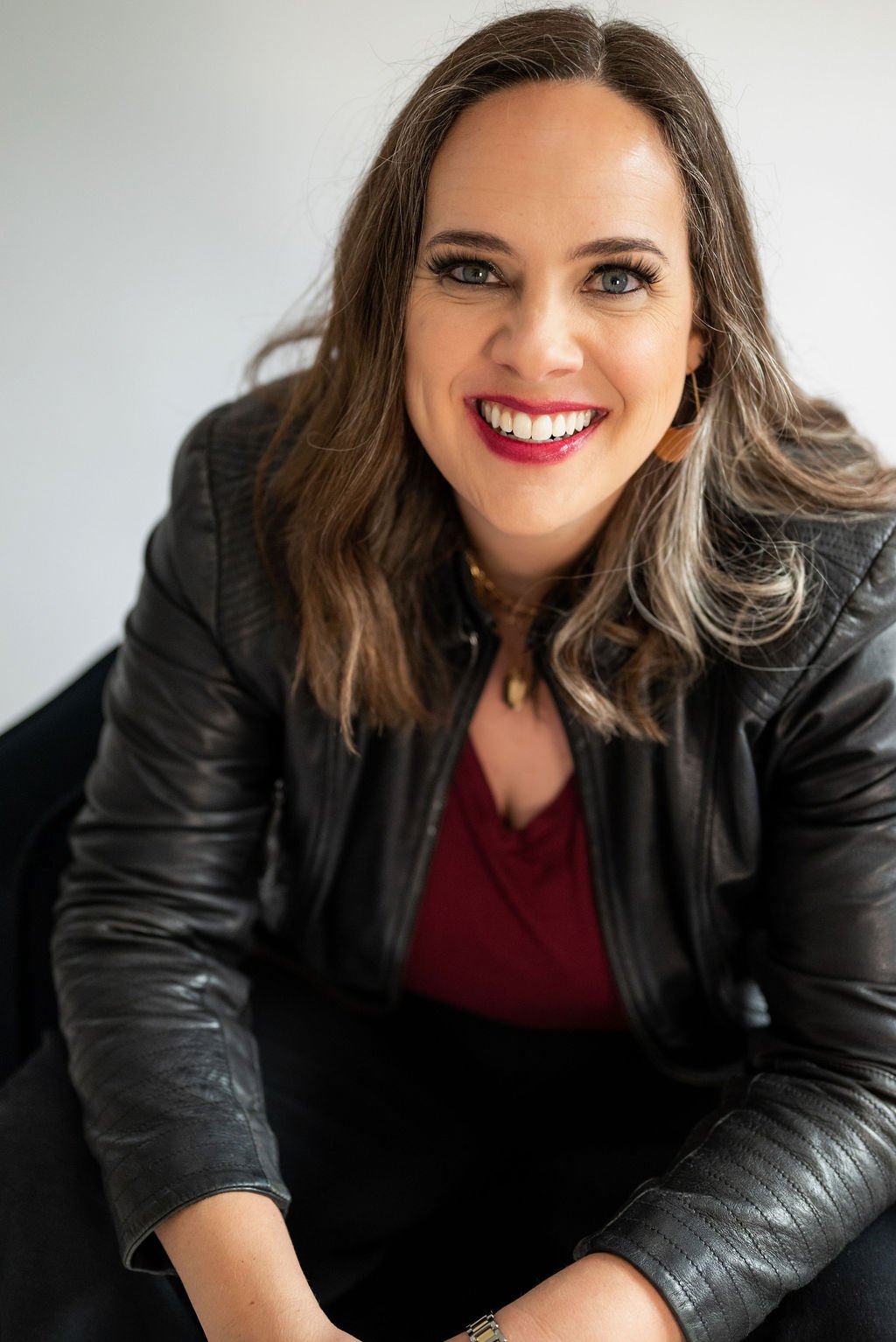 Cara Chace - Author, Speaker, Coach for Women in black leather jacket branding photo