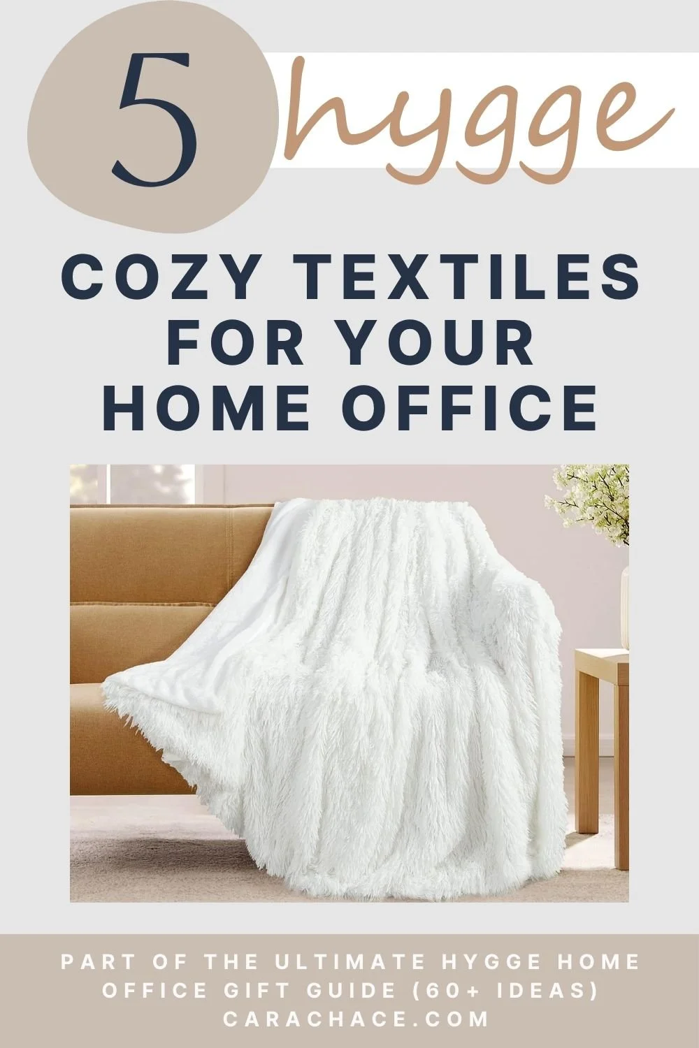 White faux fur throw blanket draped over a cozy chair for a hygge home office
