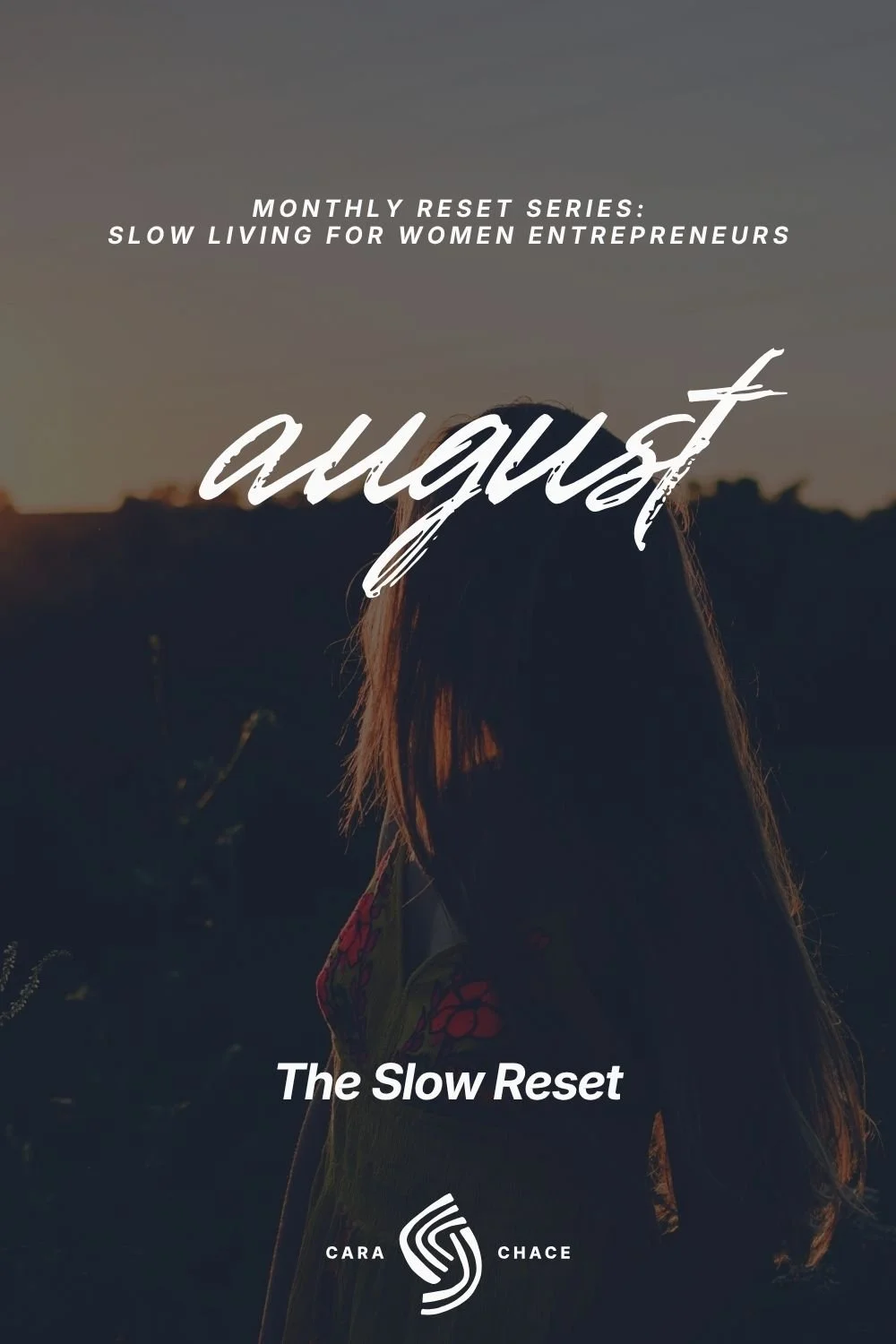 A woman with long hair stands in a field at sunset seen from behind, beside the word august and The Slow Reset.