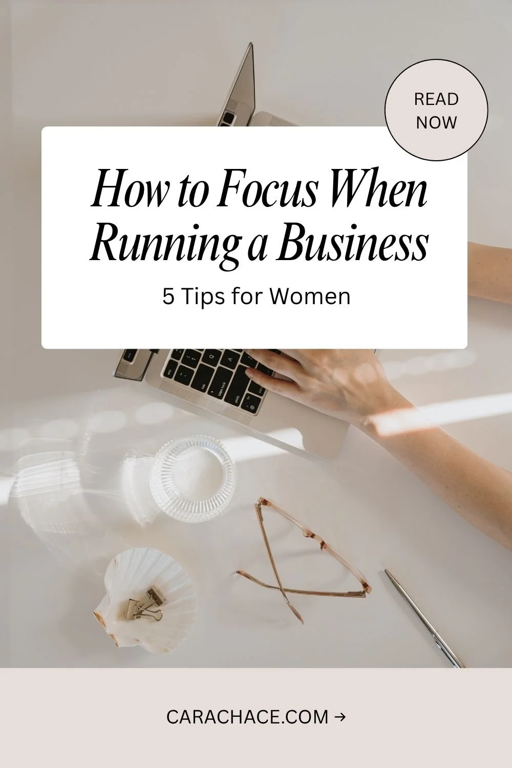 Woman's hands typing on a laptop at a bright desk, with text overlay: How to Focus When Running a Business, 5 Tips for Women