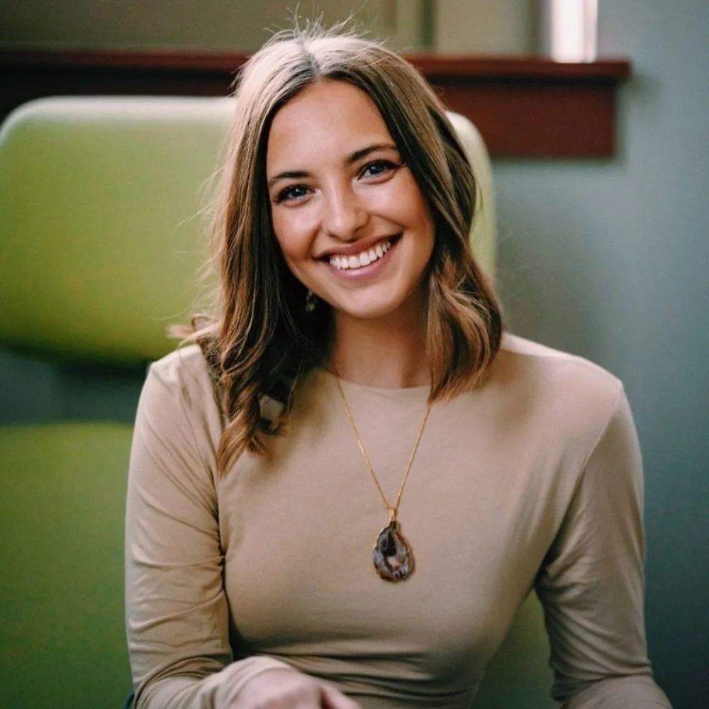 Kirsten R., a 1:1 coaching client of Cara Chace, smiling in a tan top
