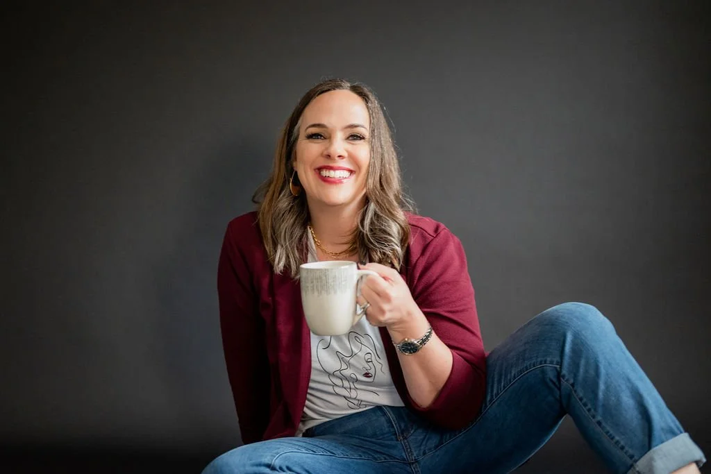 Cara Chace Social Media Burnout Author and Speaker, sitting with laptop, phone, notebook, and Ditch the Chaos mug