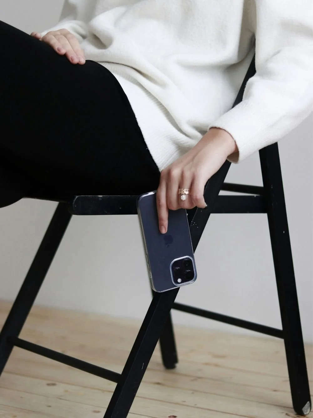 Woman business owner relaxing in a chair with her phone, time back from marketing