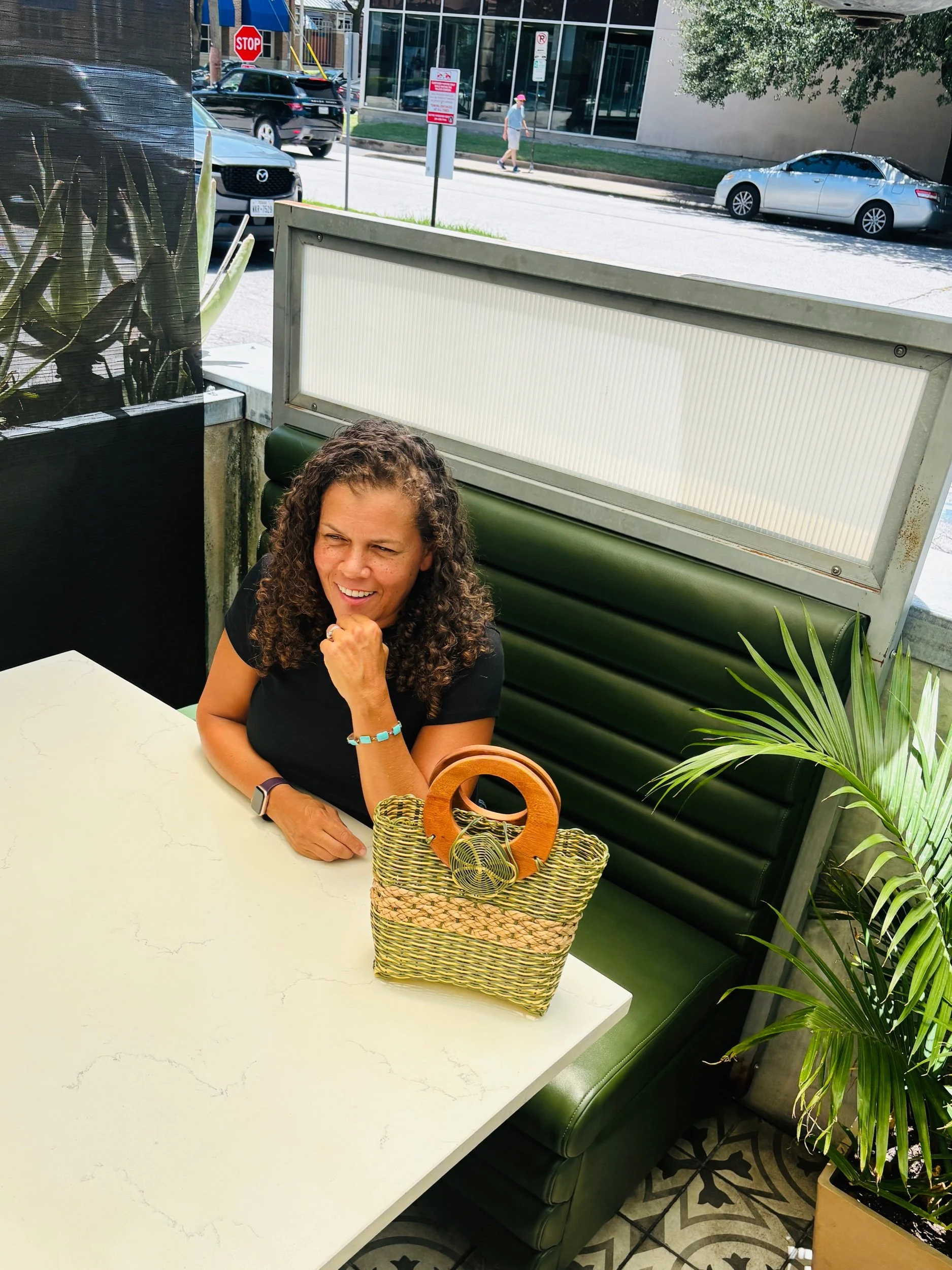 Lady with handbag at a restaurant.