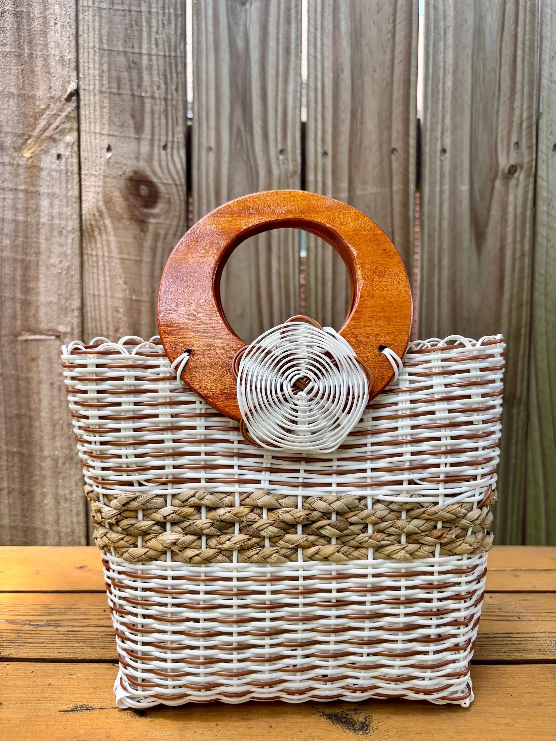 white and beige wood handle bag