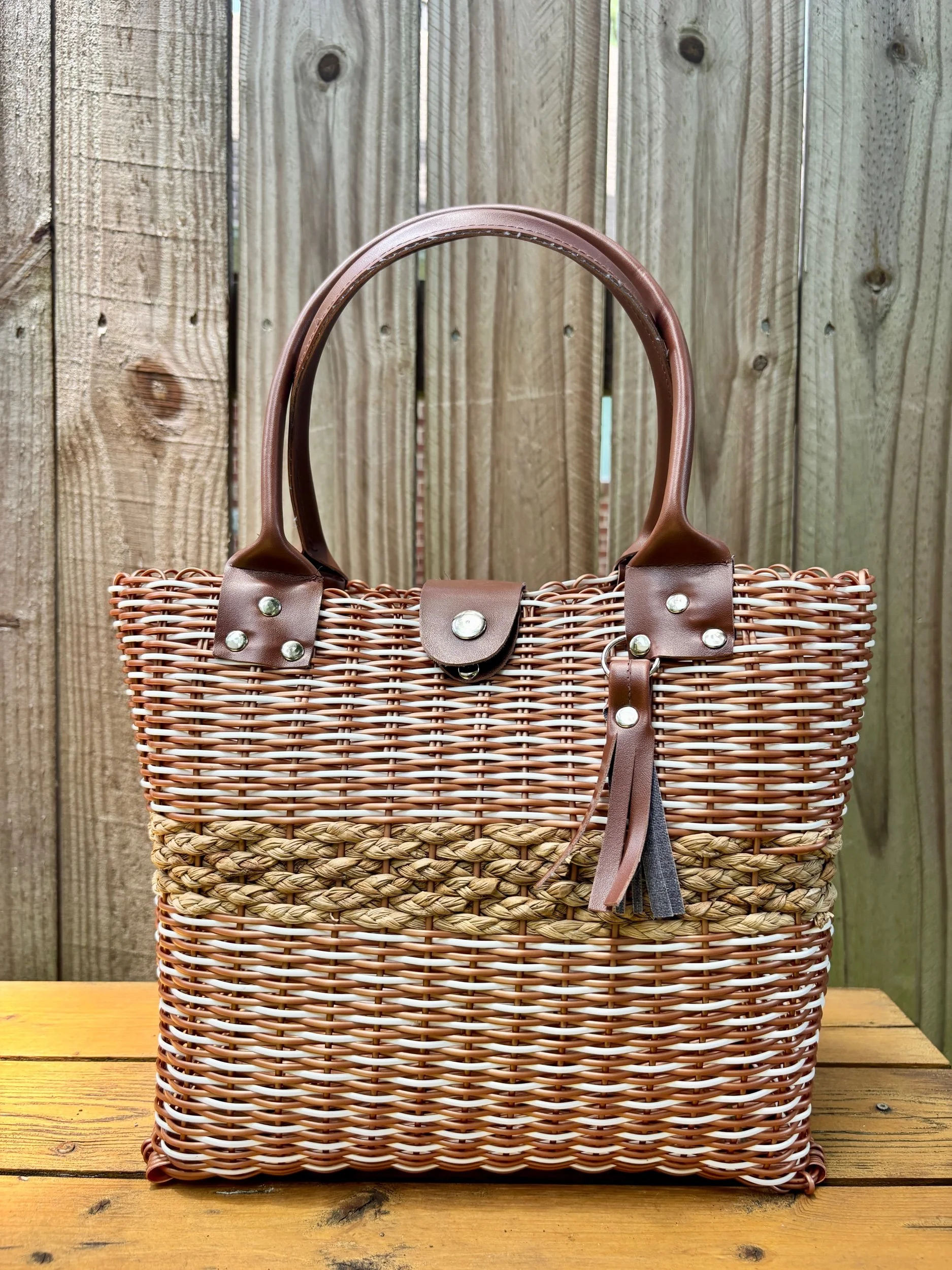 Brown handbag made from recycled plastics.
