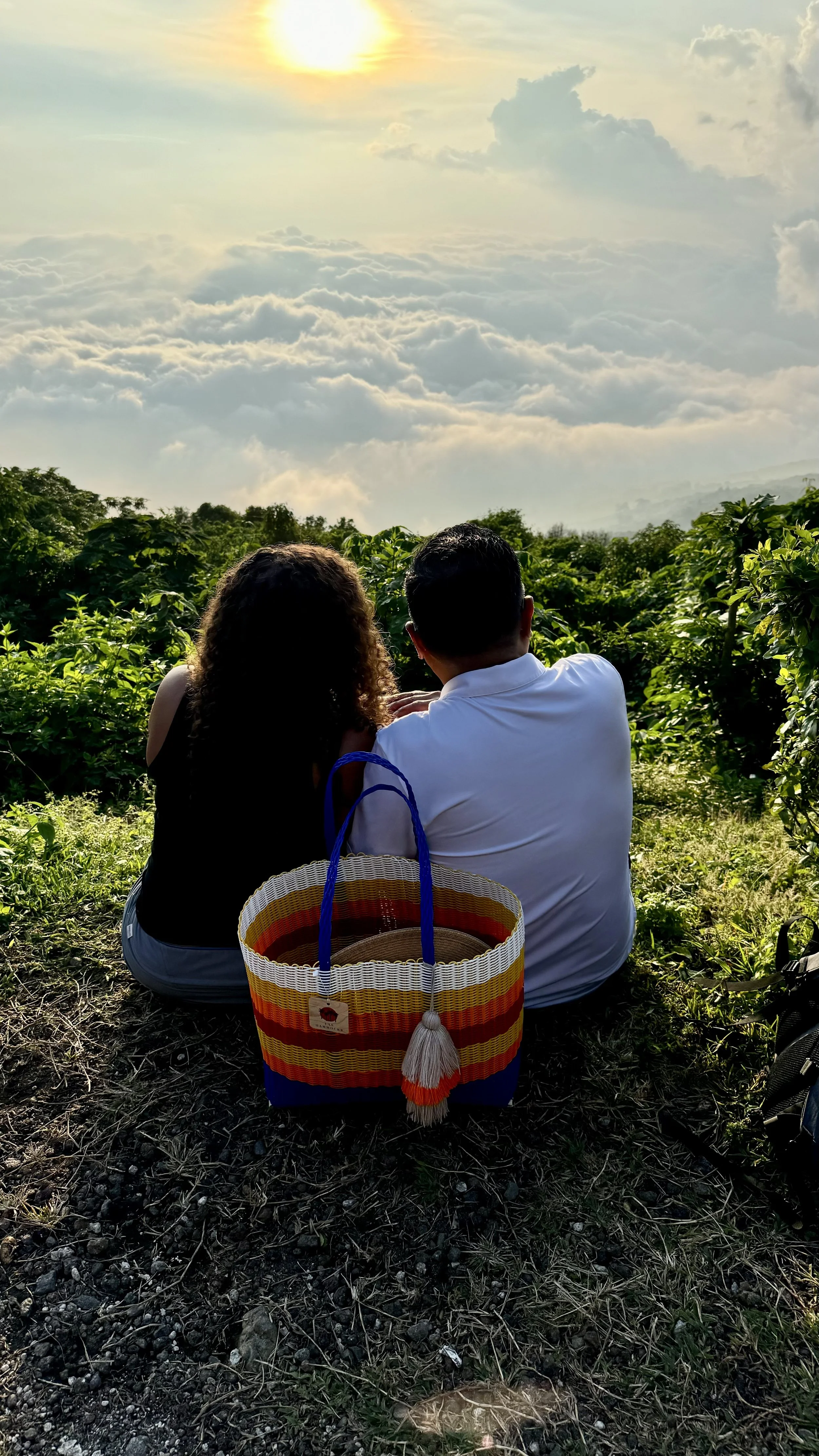 COUPLE LOOKING AT THE CLOUDS