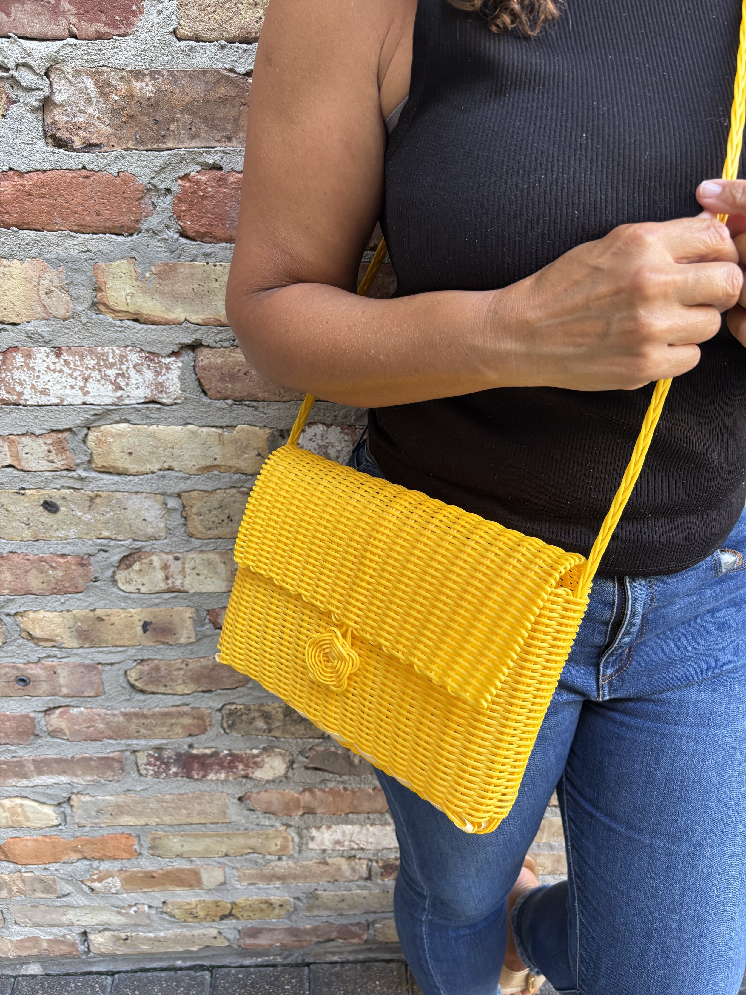 women with a yellow crossbody bag.