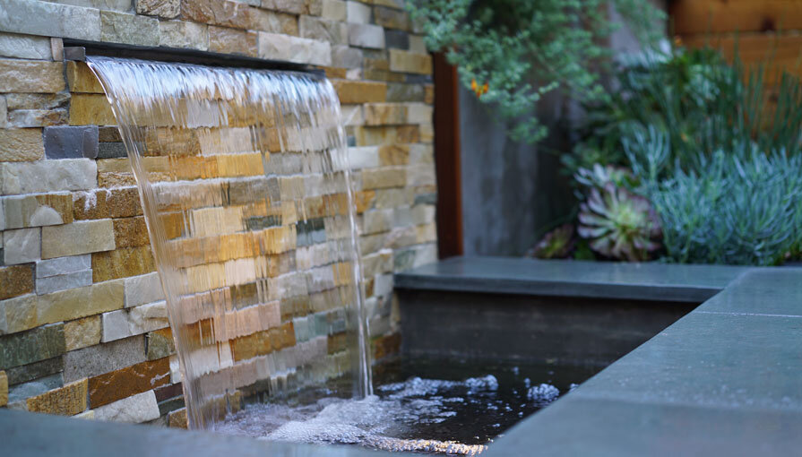 A San Francisco residential landscape design remodel with modern flair, expert craftsmanship, beautiful planting, amenities, irrigation, site lighting, retaining walls, wood deck, hot tub, spa, patio, BBQ, fire feature, bench, and paving.