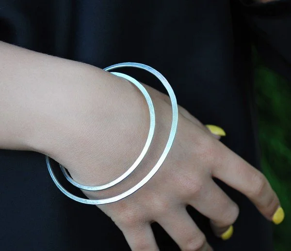 gyra_bangle_silver_latham_neve_yellow_nails.jpg