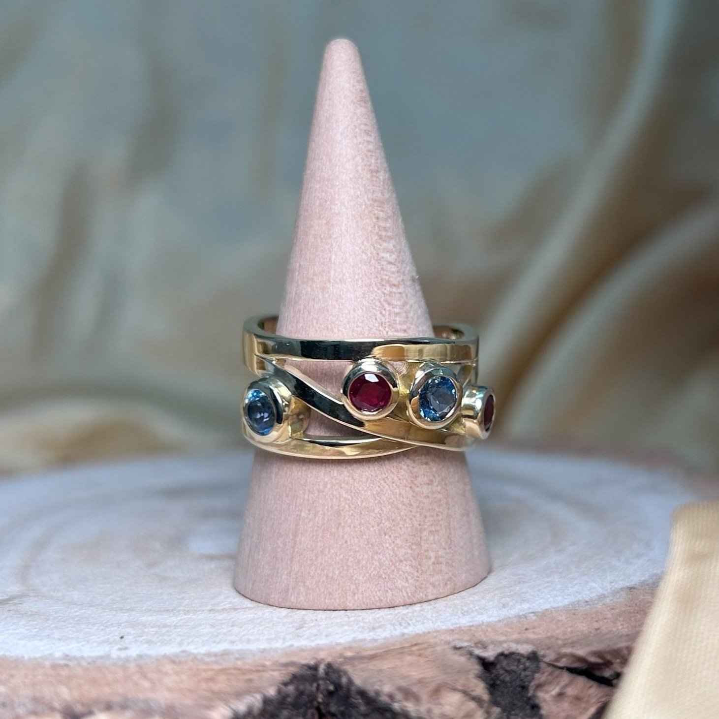 Bespoke birthstone ring with rubies and aquamarines.