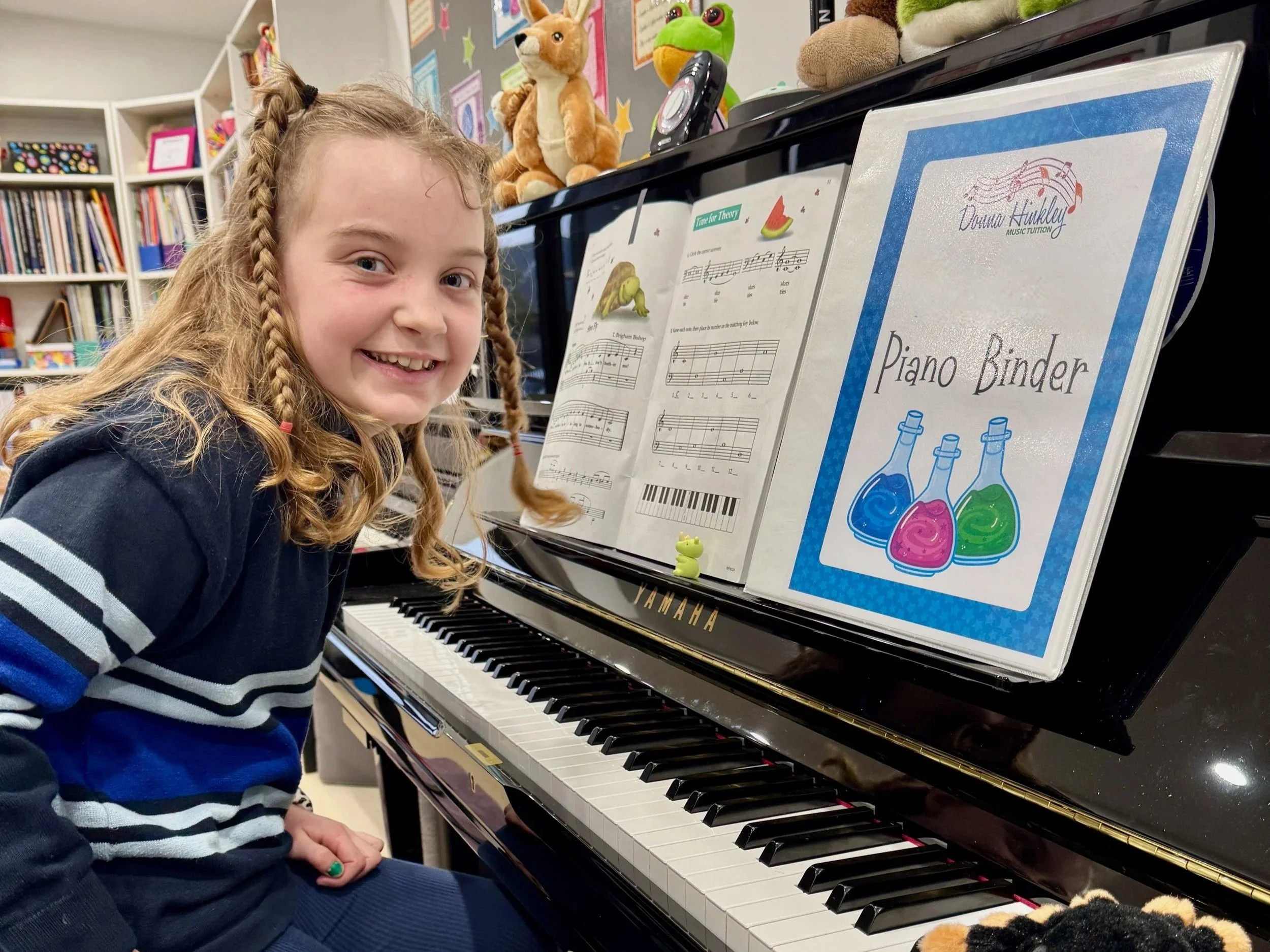 smiling student at the piano