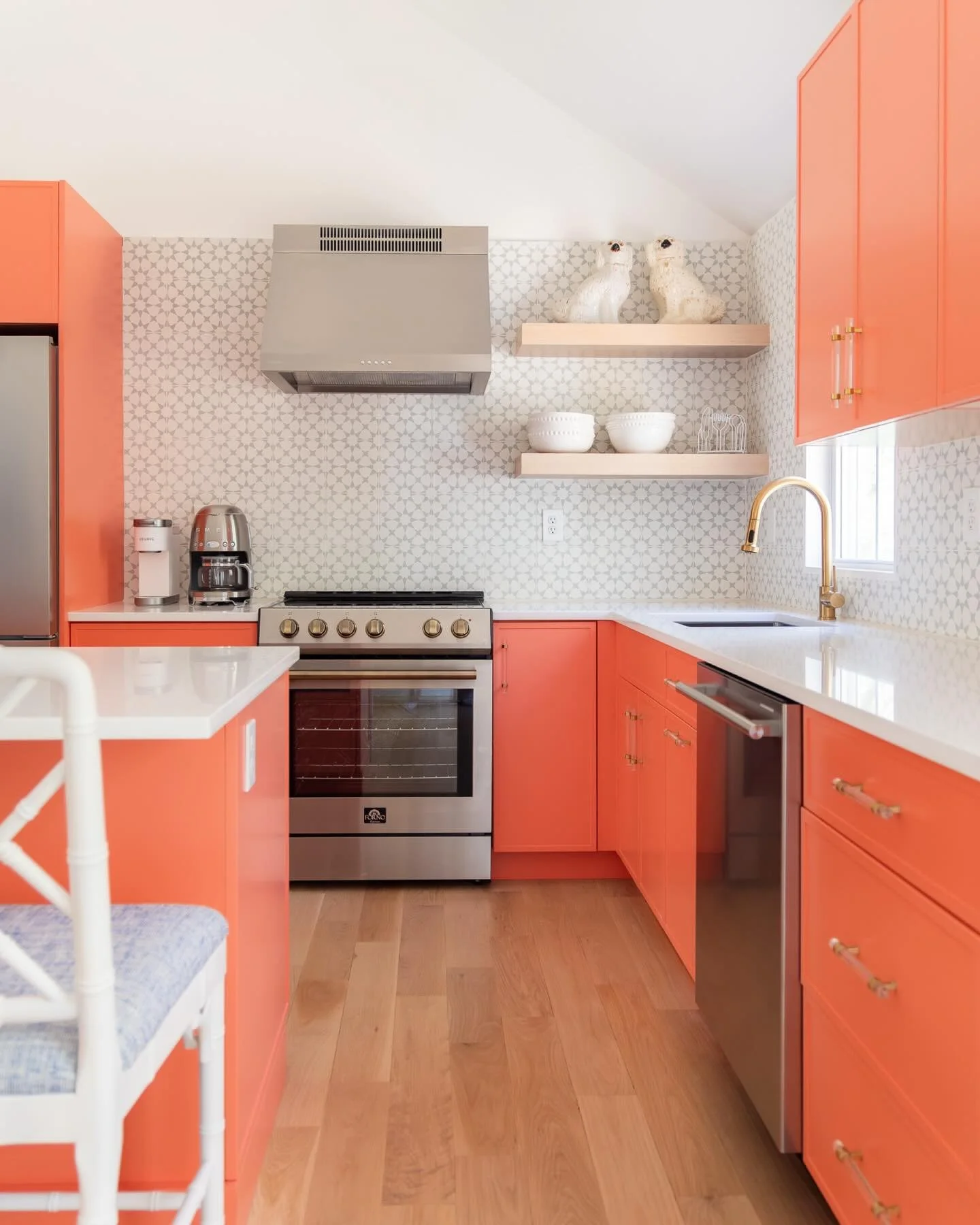 the kitchen turned out to be the most dramatic transformation at the #preppyhollowhouse. first, we removed the wall between the kitchen and living room to create one large open-concept space, then we vaulted the ceiling in the kitchen area to achieve