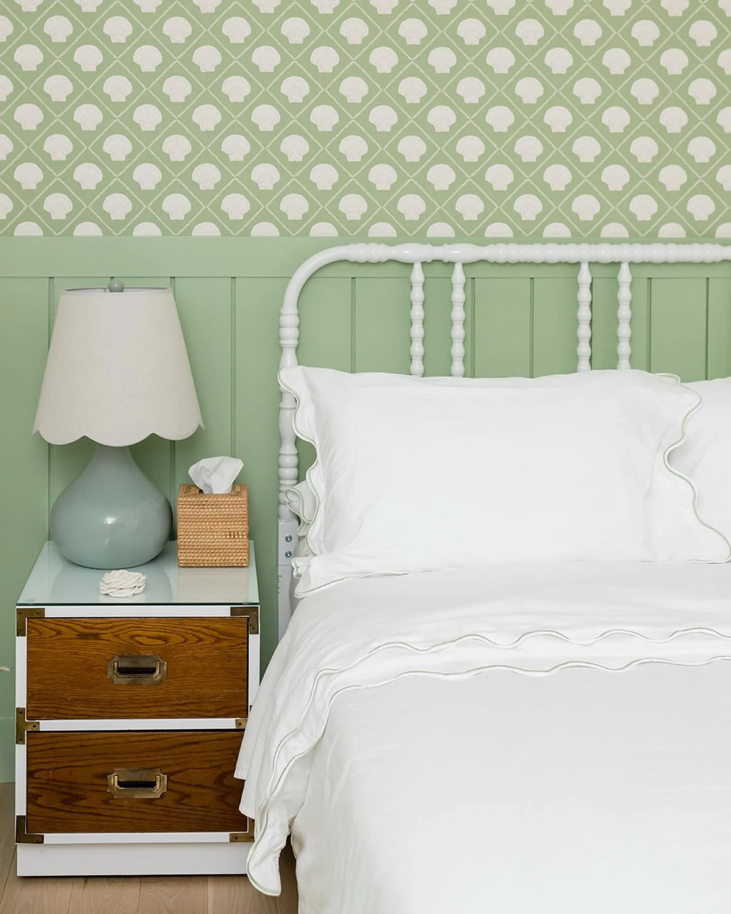 this bedroom at the #preppyhollowhouse may be small, but it has a lot of personality thanks to the pretty green paint and shell wallpaper. vintage wood furniture adds contrast, while a white metal spindle bed coordinates with the shell wallpaper. #dw