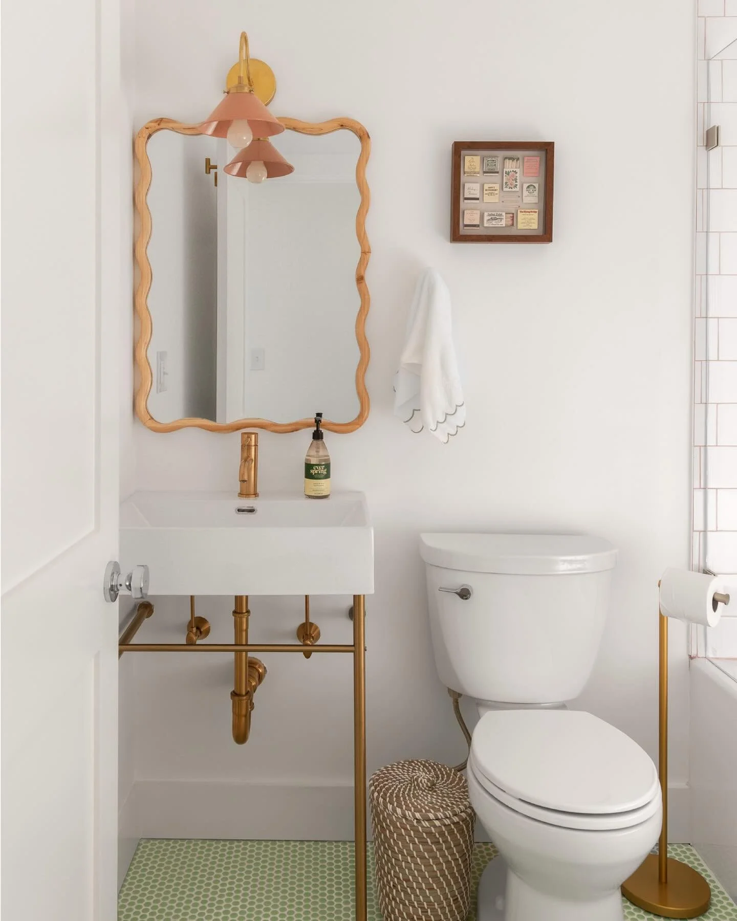 located off the main hallway, the guest bathroom at the #preppyhollowhouse was an interior bathroom, meaning that it had no windows and therefore, no natural light. as a result, we aimed to create a bold and bright design full of color in order to gi