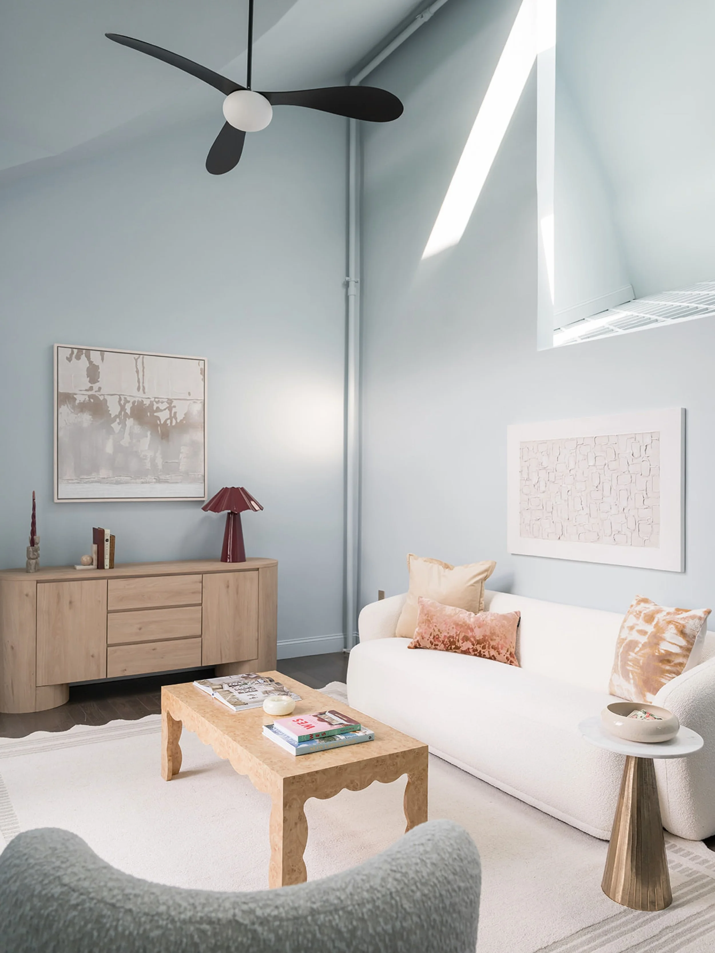 the living room at the #dwelloctoberstudio project has the most amazing light thanks to the combination of the large sliding doors, transom window, and skylights. it also features unique woodwork where the organ was located during the building&rsquo;