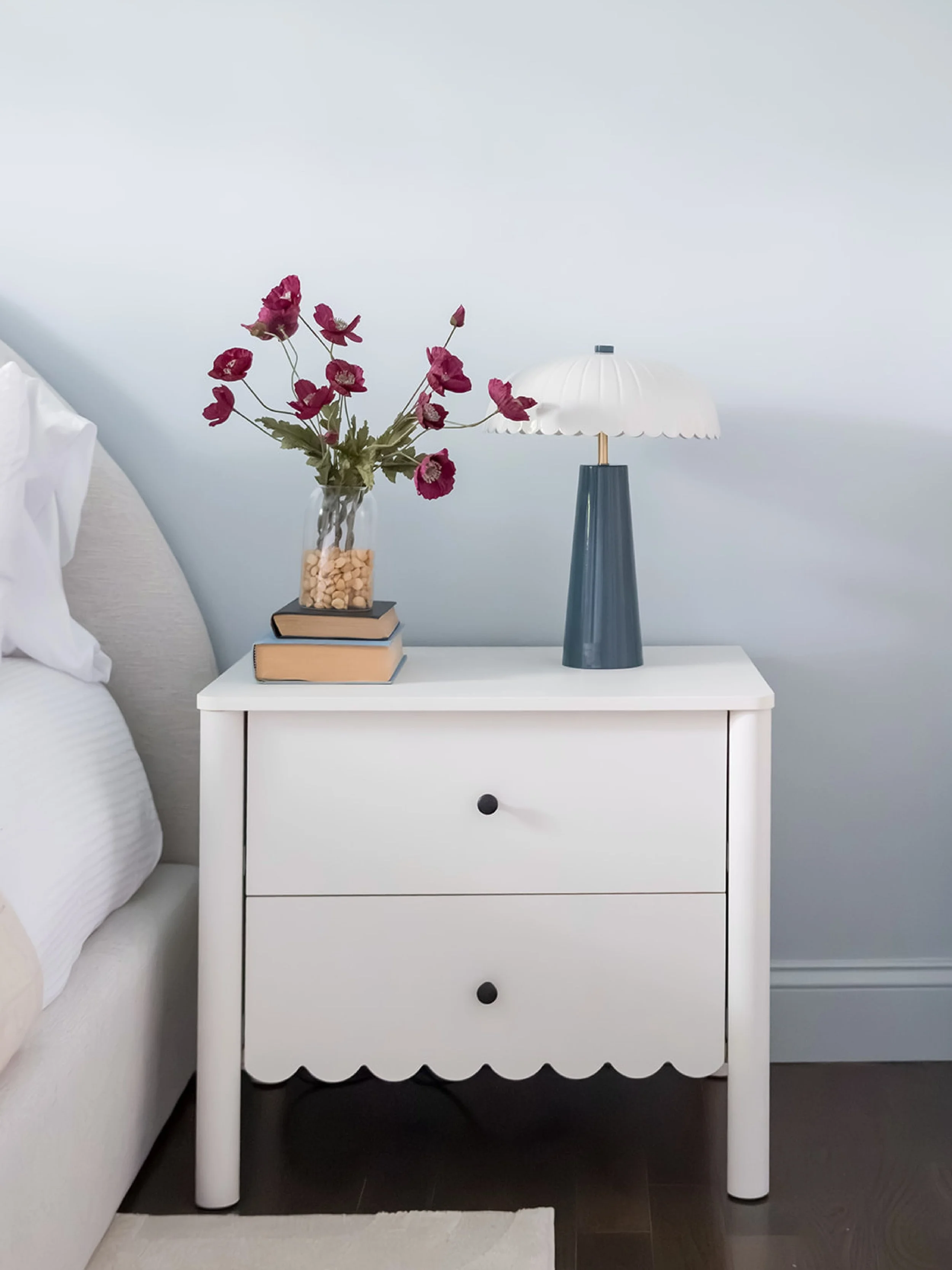 we&rsquo;re loving all the pretty details in the bedroom at this #dwelloctoberstudioproject! from the scalloped nightstands to the fun artwork, these special touches make the room feel chic and cozy at the same time. #dwelloctober 📷 @wearefreebird