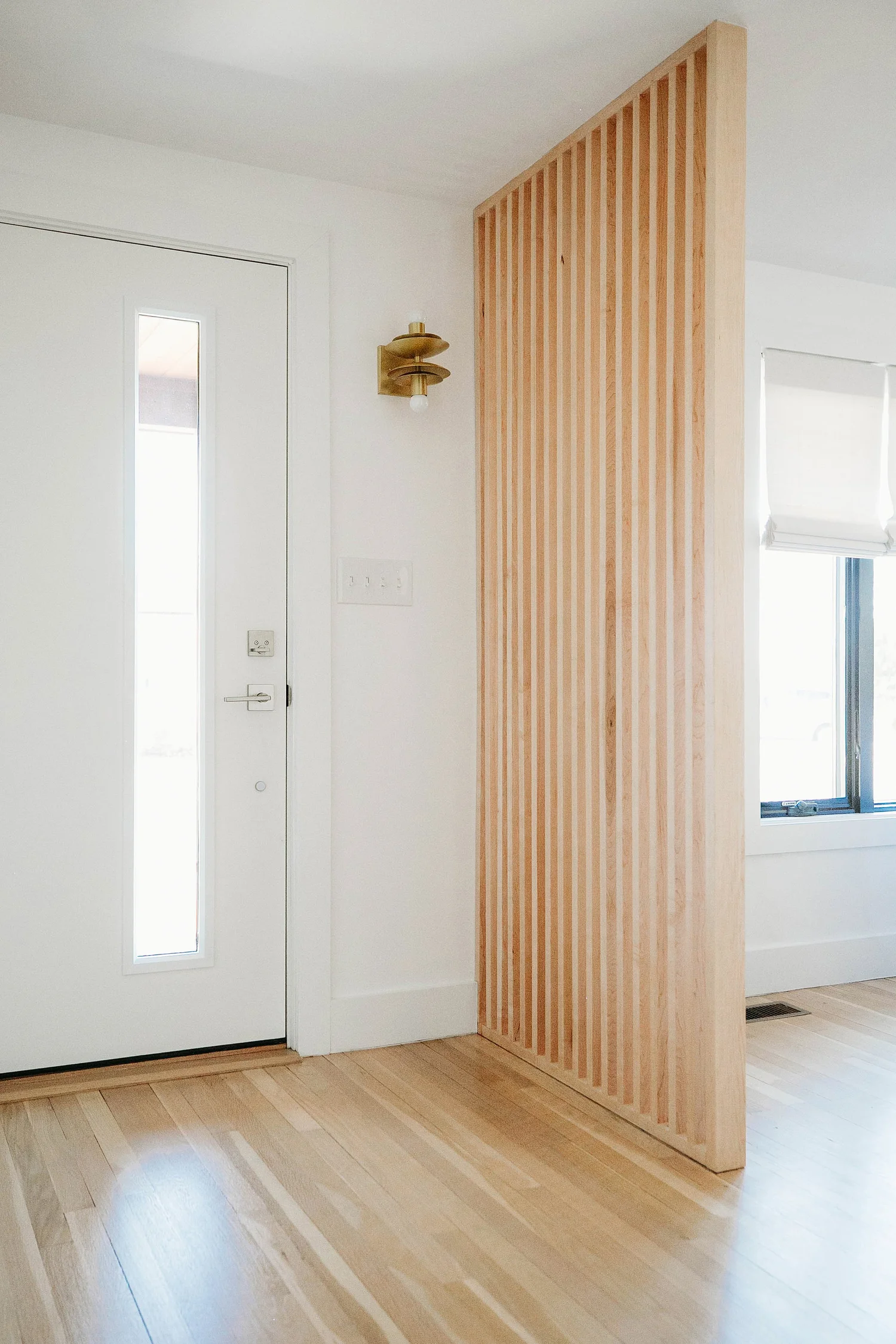 A divided entry at a #dwelloctoberstudio mid-century modern fixer-upper ...