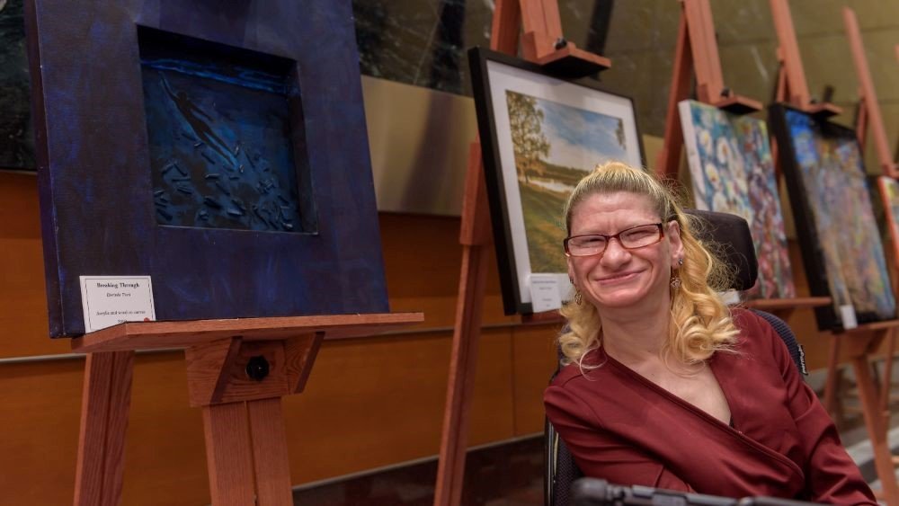 Dorinda with artwork.jpg