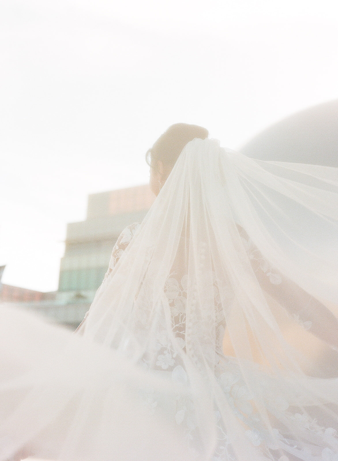 Artistic documentary close up portrait of black bride with veil. At the Chase Center. Photo by San Francisco wedding photographer Michaela Joy Photography.