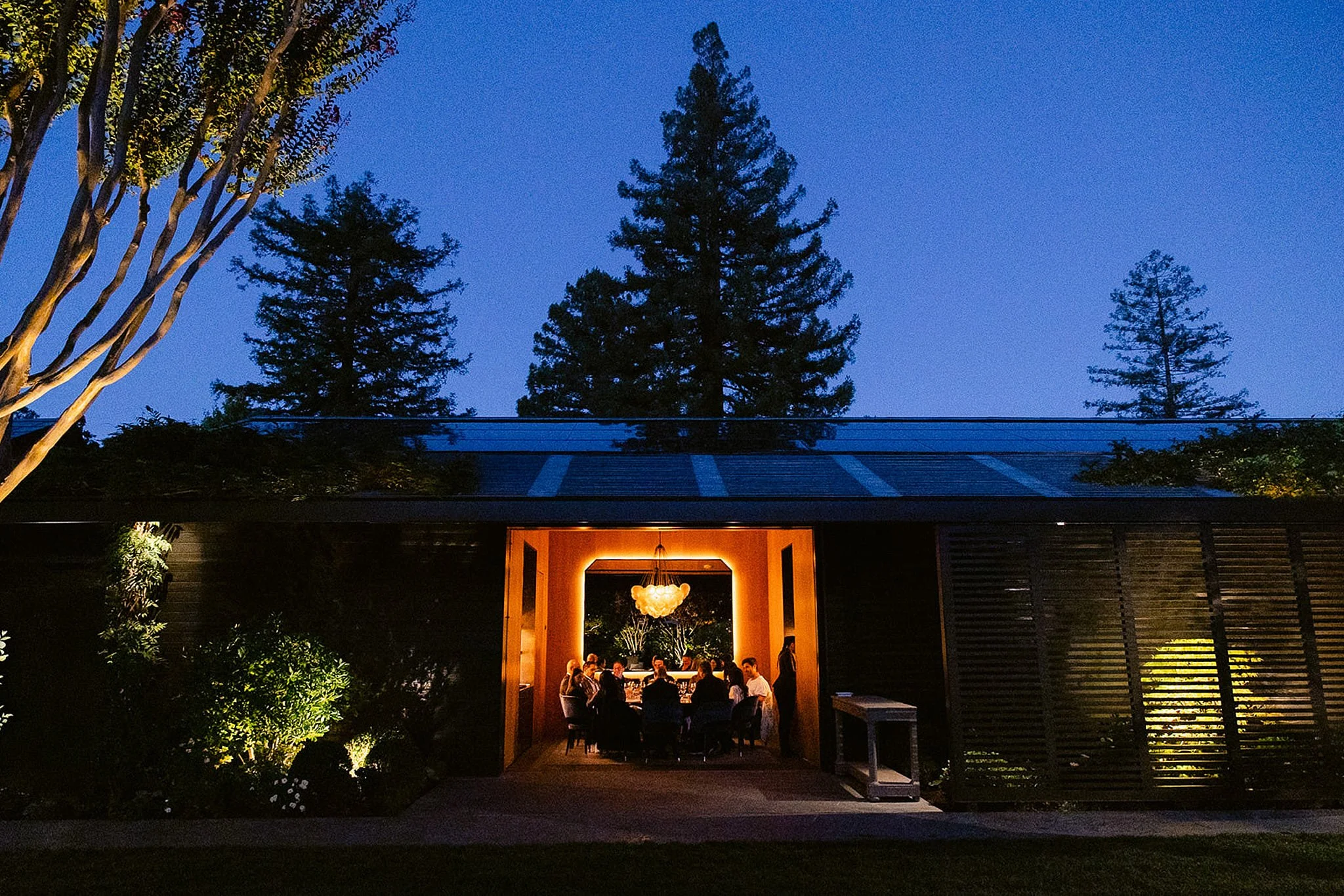 Intimate luxury corporate dinner hosted at an exclusive Napa Valley vineyard pavilion at twilight. High-end retreat photography by Michaela Joy Photography.