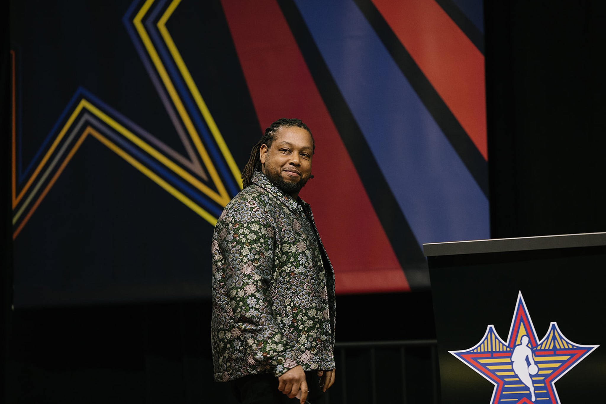 Candid portrait of NBA executive speaking on stage during a high-profile corporate event. San Francisco conference photography by Michaela Joy Photography.
