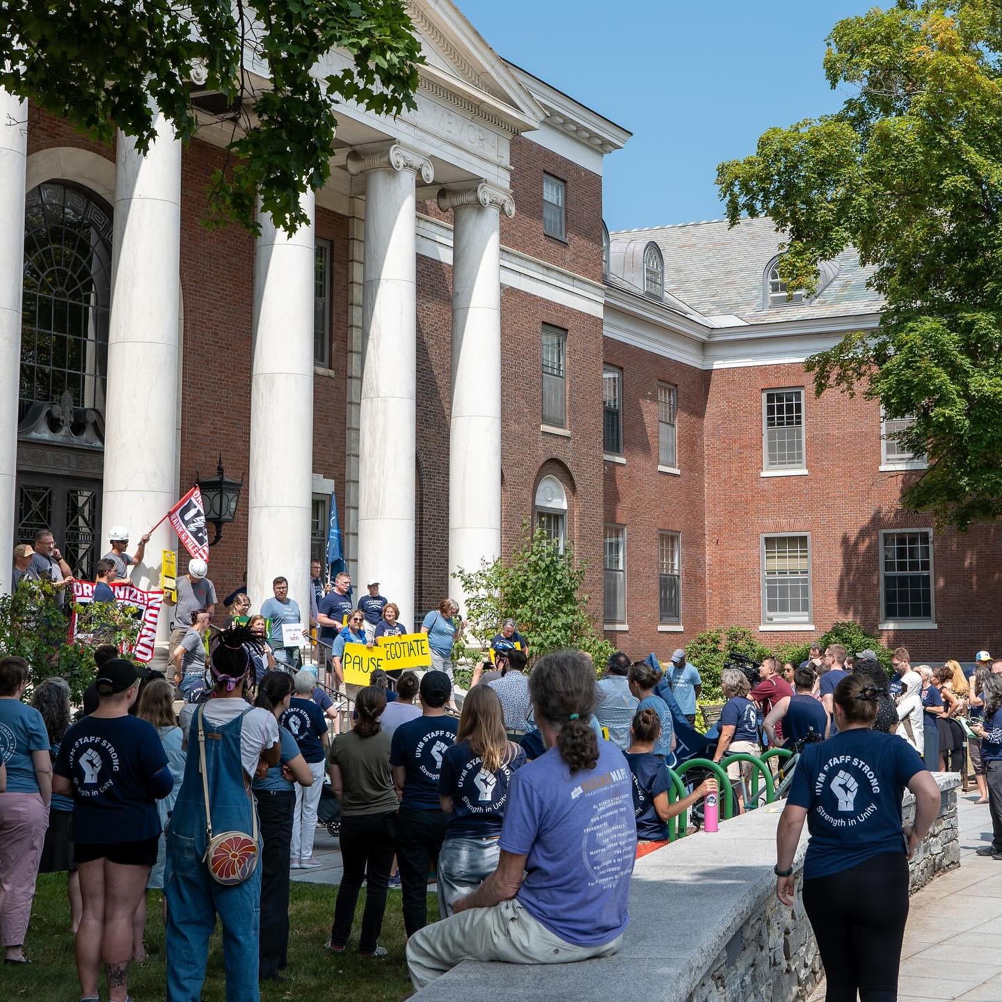 1-2-3-4 THE WORKERS ARE OUTSIDE YOUR DOOR! 5-6-7-8 PAUSE AND NEGOTIATE! Members from UE Local 267, United Academics, and UVM Staff United gathered on the steps of Waterman to demand that President Marlene Tromp pause the unsafe and unnecessary depend