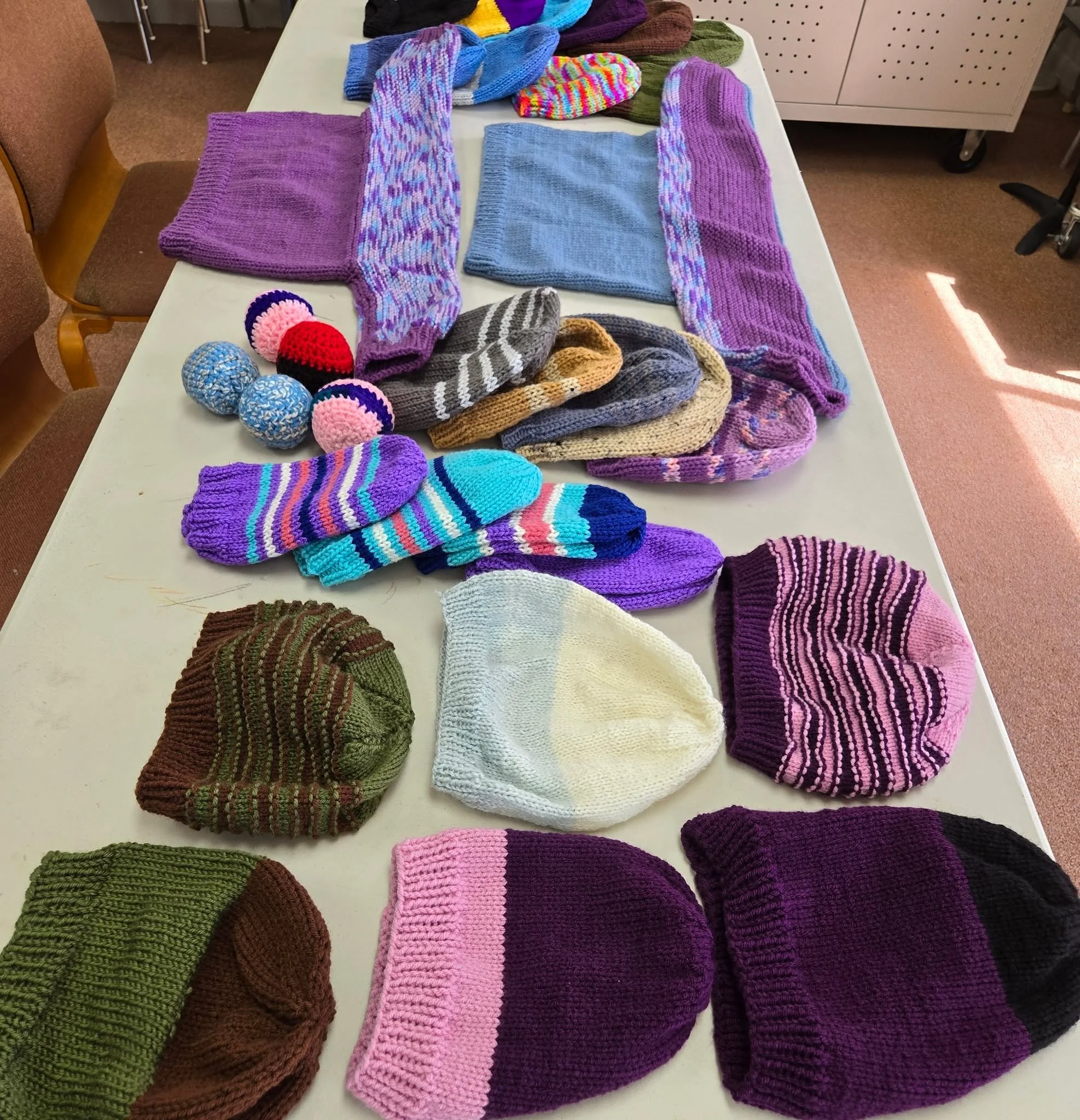 Here is a snapshot of some of the sweaters, caps, and balls that have recently been knit by our Knit for Kids Group to be distributed at a school down in Tijuana. Knit for Kids meets on a monthly basis. Reach out to the church office if you are inter