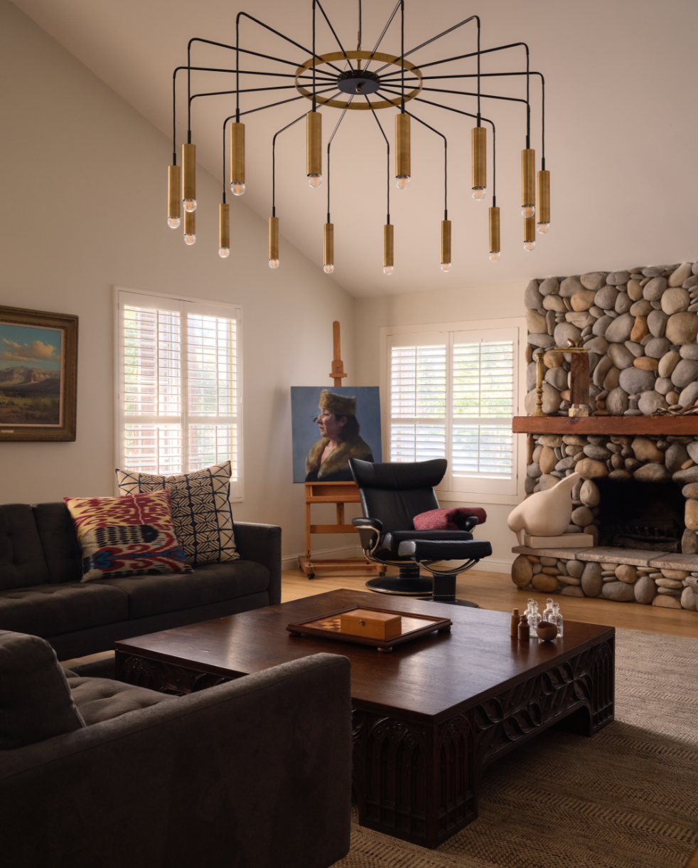 Living room complete home remodel with a brass starburst chandelier, vaulted wood-beamed ceiling, river-rock stone fireplac, Alamo Farmhouse remodel (Jackson Way, Alamo) by award-winning design studio Spearman Spaces
