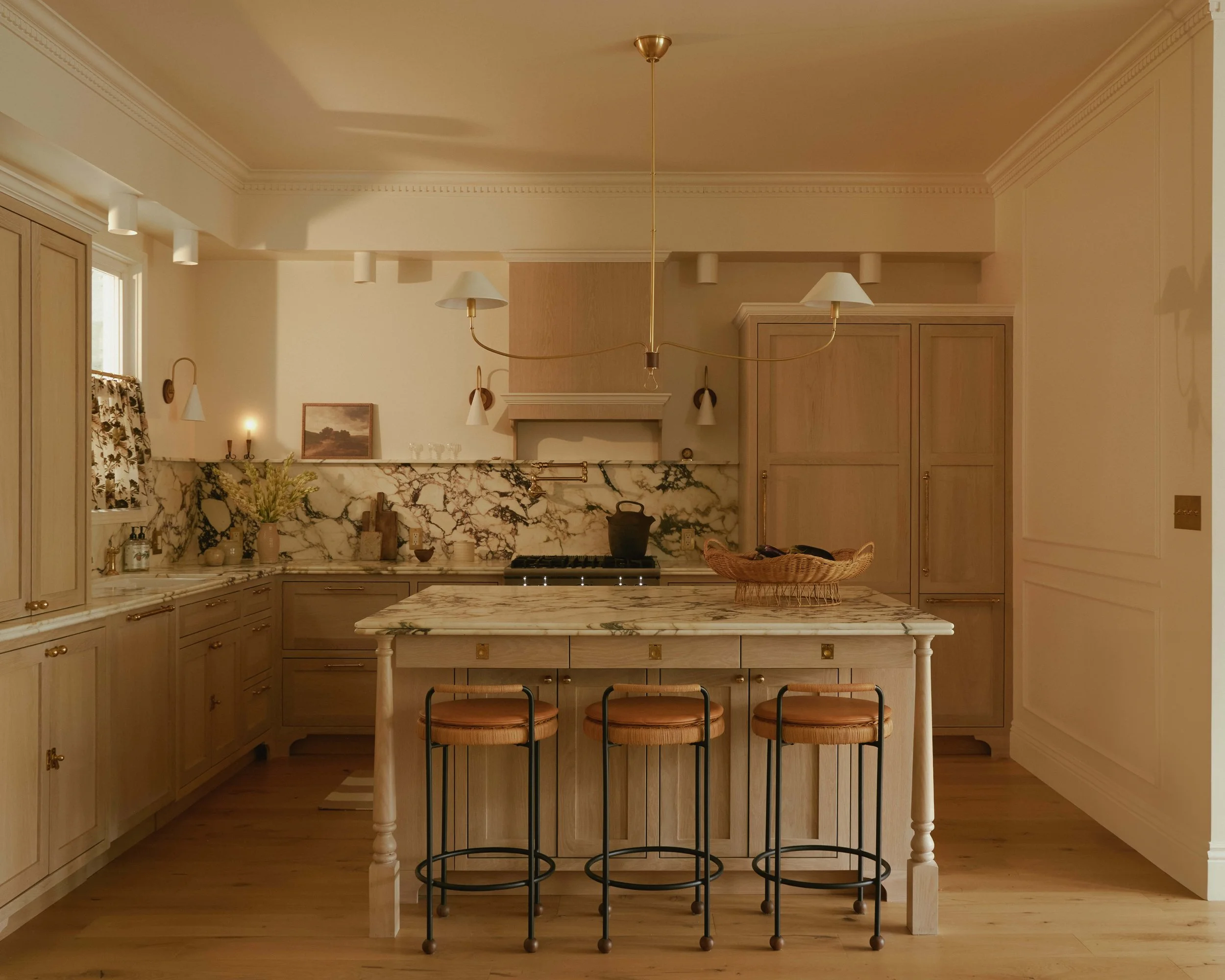 Eclectic San Francisco kitchen with mixed metal finishes and layered art, designed by Spearman Spaces
