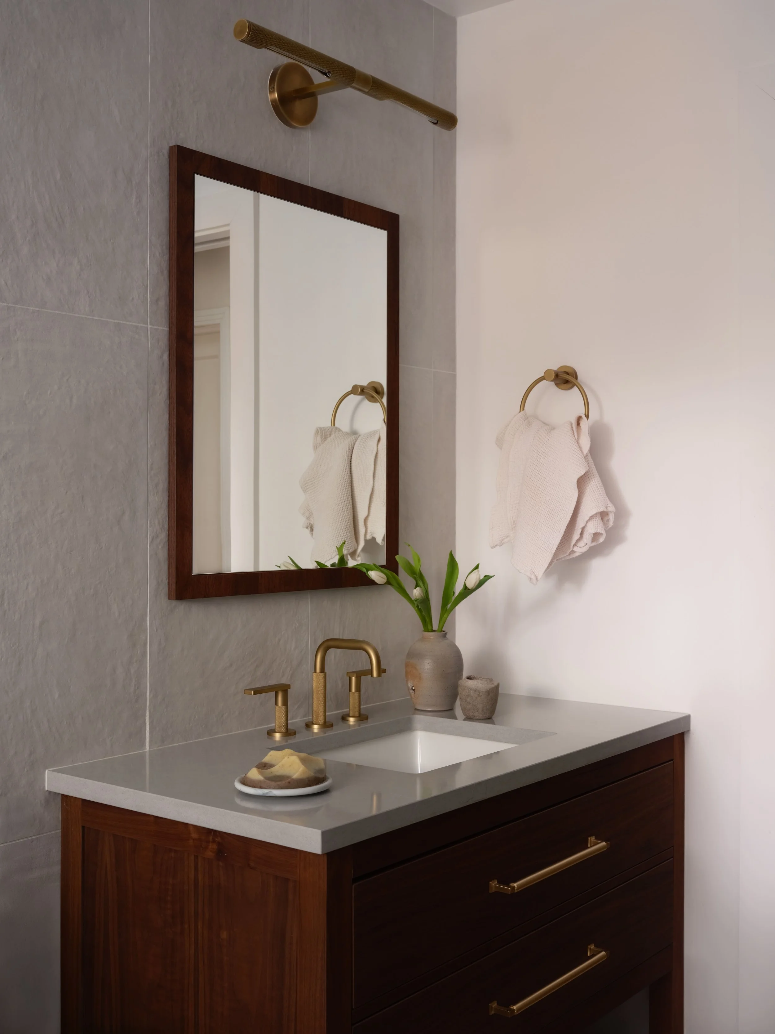 Bathroom mirror and brass towel bar detail, Alamo Farmhouse (Jackson Way) pool house full-service renovation by Spearman Spaces