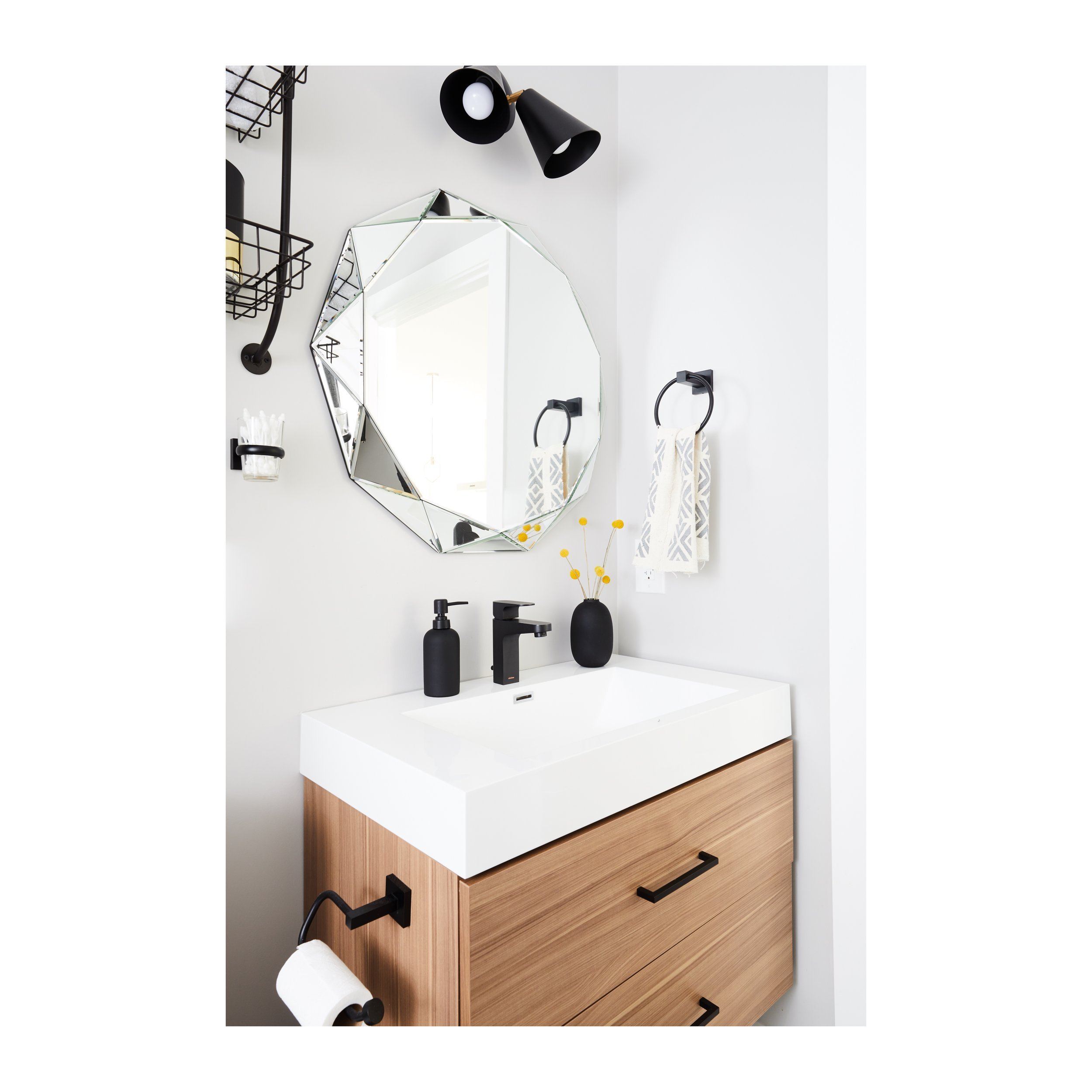 Bathroom with faceted octagonal mirror, black matte fixtures, and a floating oak vanity, San Francisco Craftsman Victorian historic gut renovation by Spearman Spaces