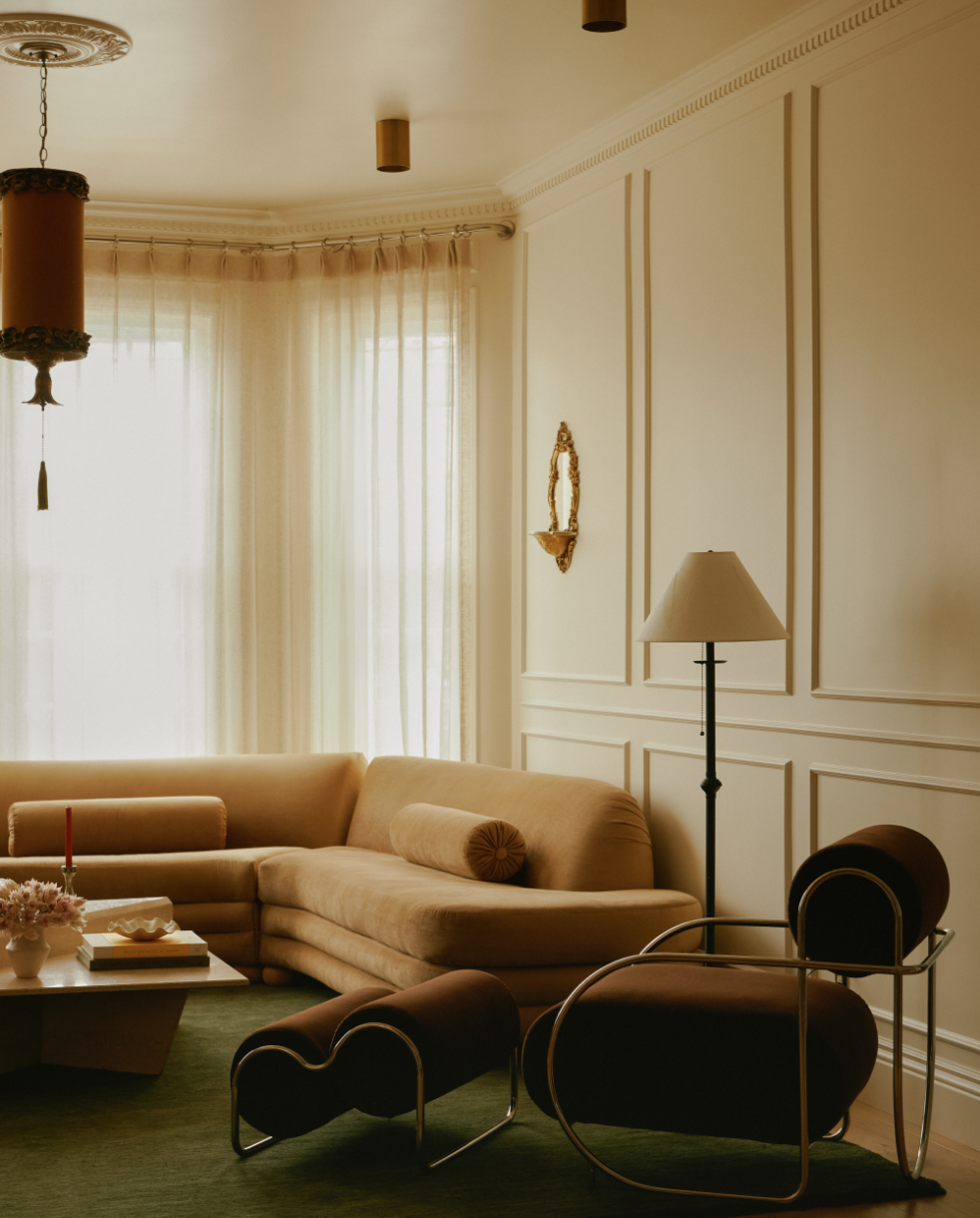 San Francisco Modern Victorian gut renovaated living room featuring ornate rosette, crown molding and modern curved seating space by Spearman Spaces, an award-winning full-service interior design studio.