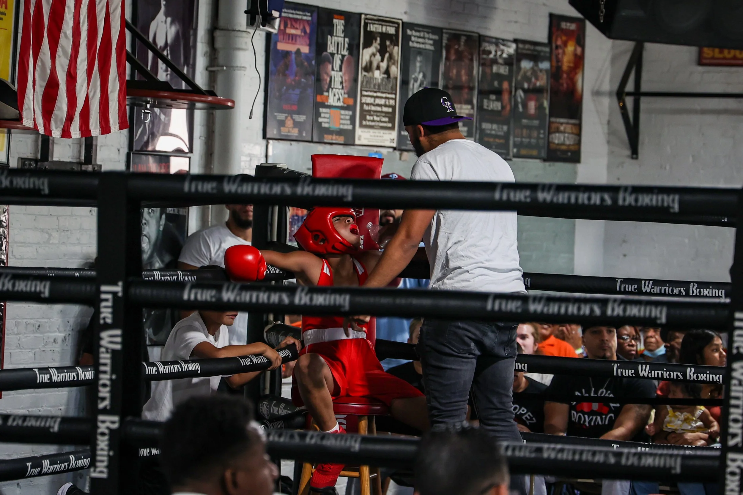 A young boxer from Ike & Randy's gym sits in his corner in between rounds at the True Warriors Boxing gym in Paterson. 