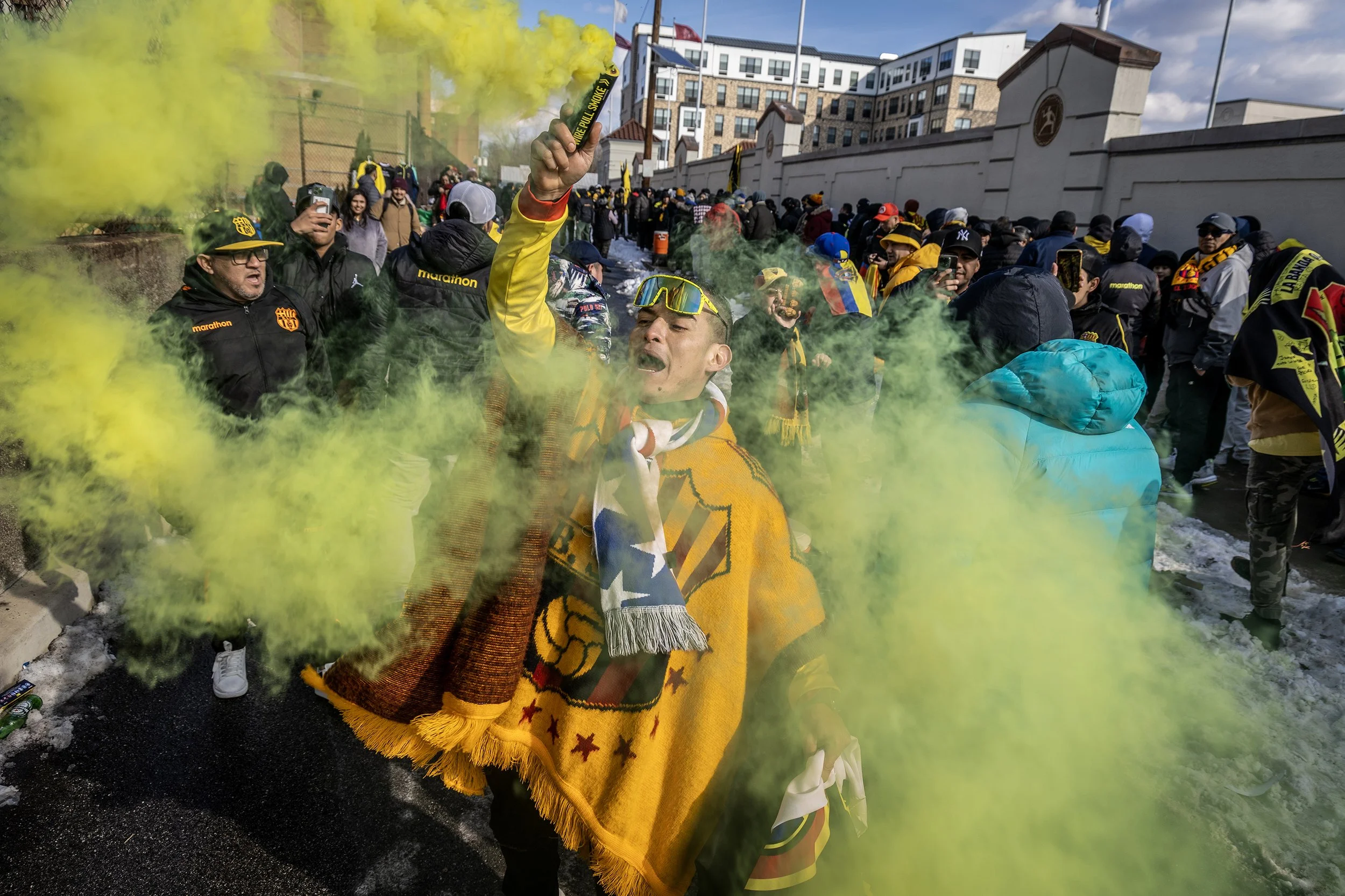 PATERSON, N.J. | January 27, 2025 — A Barcelona SC soccer fan, uses handheld smoke flare outside Hinchliffe Stadium prior to the Barcelona SC vs. Osner’s FC friendly soccer match.