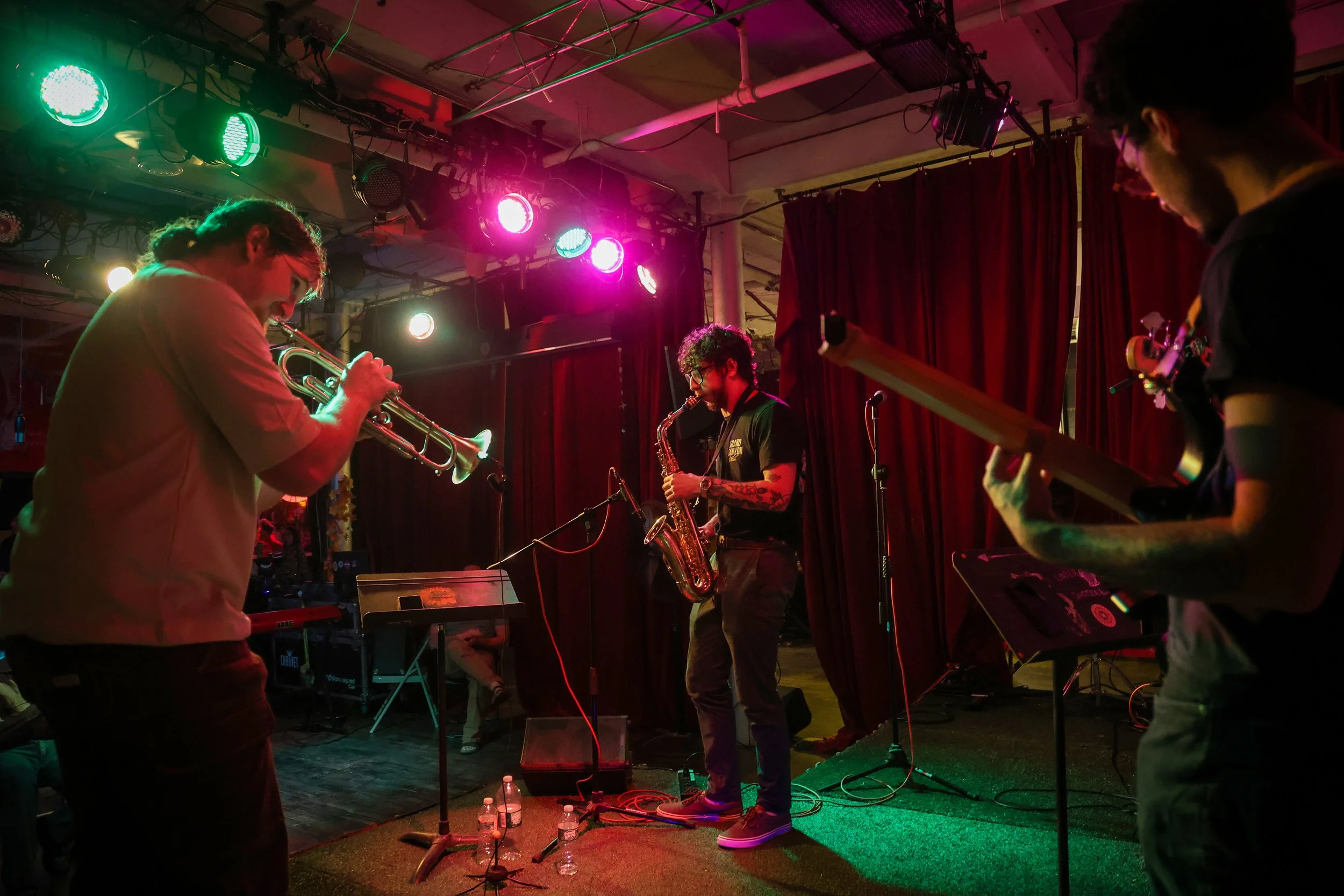 PATERSON, N.J. | June 16, 2025: Musicians take part in a jam session during open mic night at Prototype 237, an independent arts and performance space housed in a former industrial warehouse along the Passaic River in Paterson. Founded in 2022 by loc