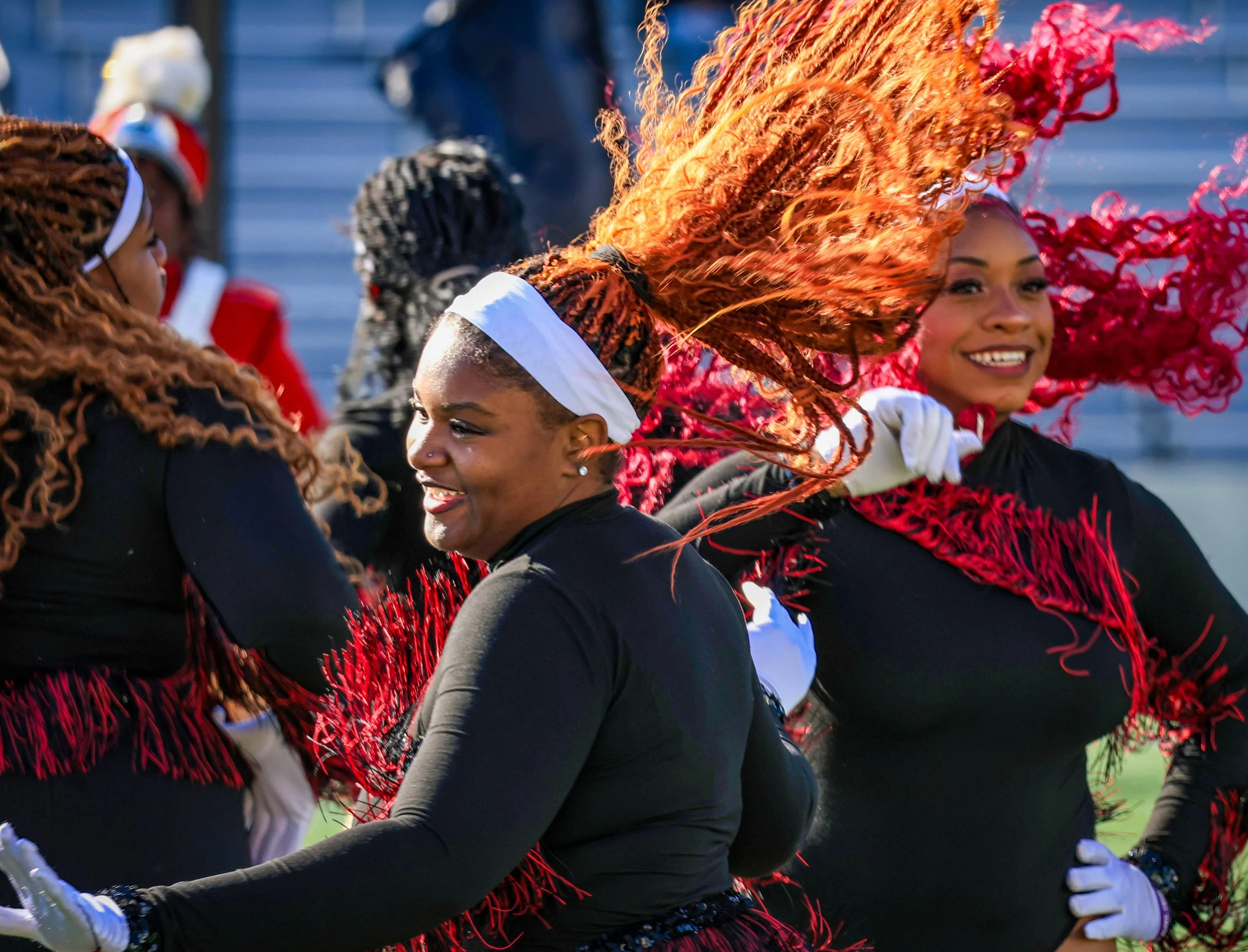 PATERSON, N.J. | Nov. 27, 2025: Janiyah Waites, a majorette with the JFK High School marching band, performs as her colorful hair catches the sunlight, continuing one of Paterson’s oldest Thanksgiving traditions. The band marched from Kennedy HS to H