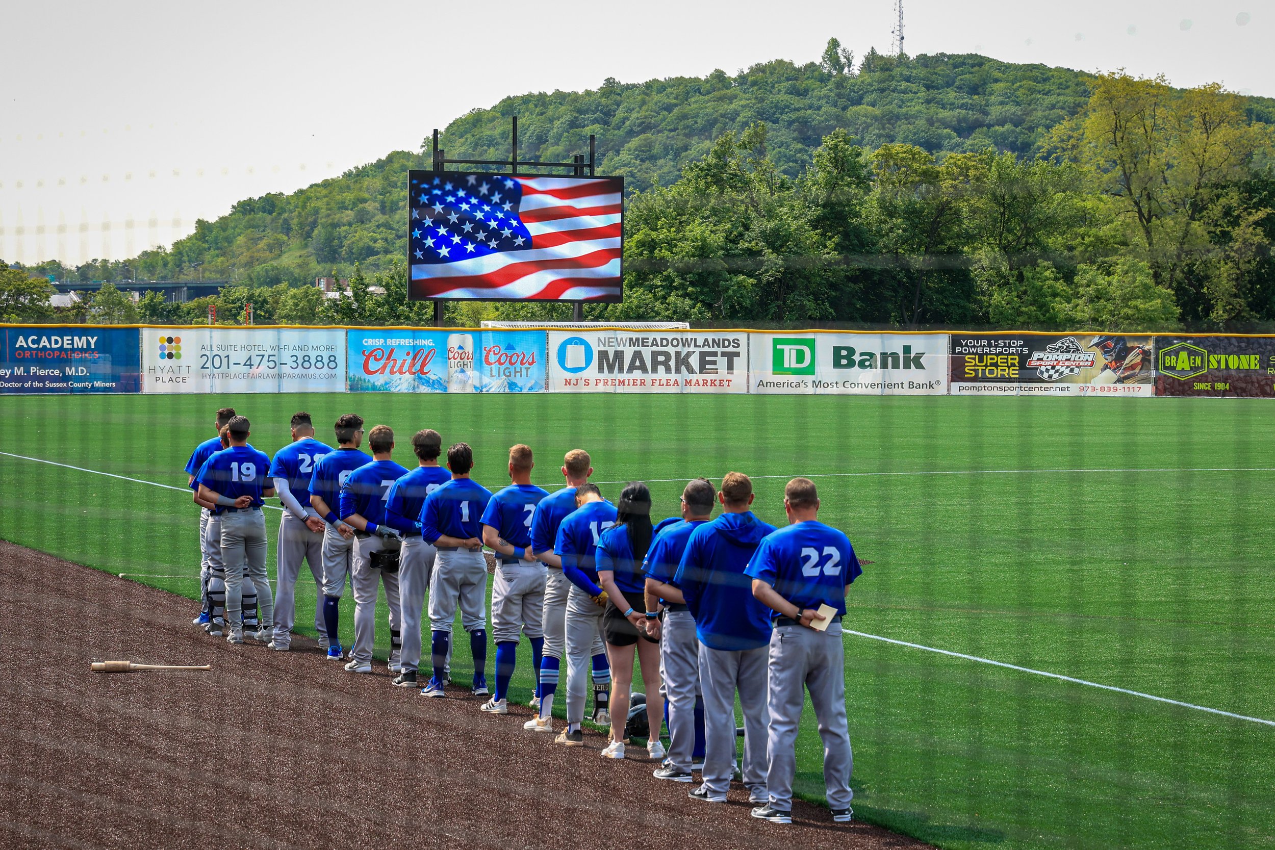 05-24-23 HINCHLIFFE STADIUM GRAND OPENING: Player stand for the national anthem before the game, as the New Jersey jackals hosted the first professional baseball game at the newly renovated Hinchliffe stadium.