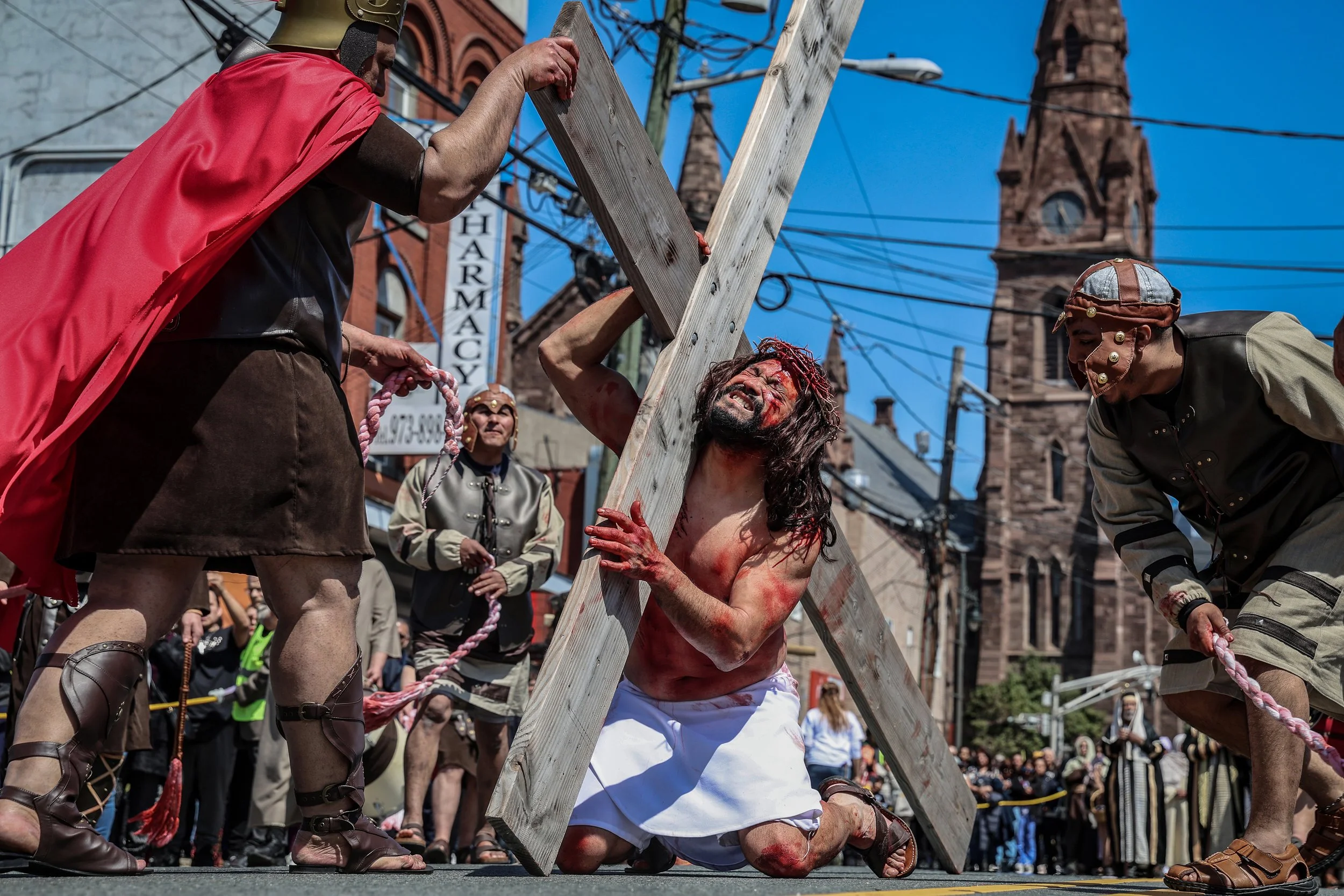 PATERSON, N.J. | April 18, 2025: Sebastian Delgado portrays Jesus during an emotional Good Friday Passion Play on the streets of Paterson. The annual Way of the Cross reenactment traces Jesus Christ’s final hours—from arrest to crucifixion—beginning 