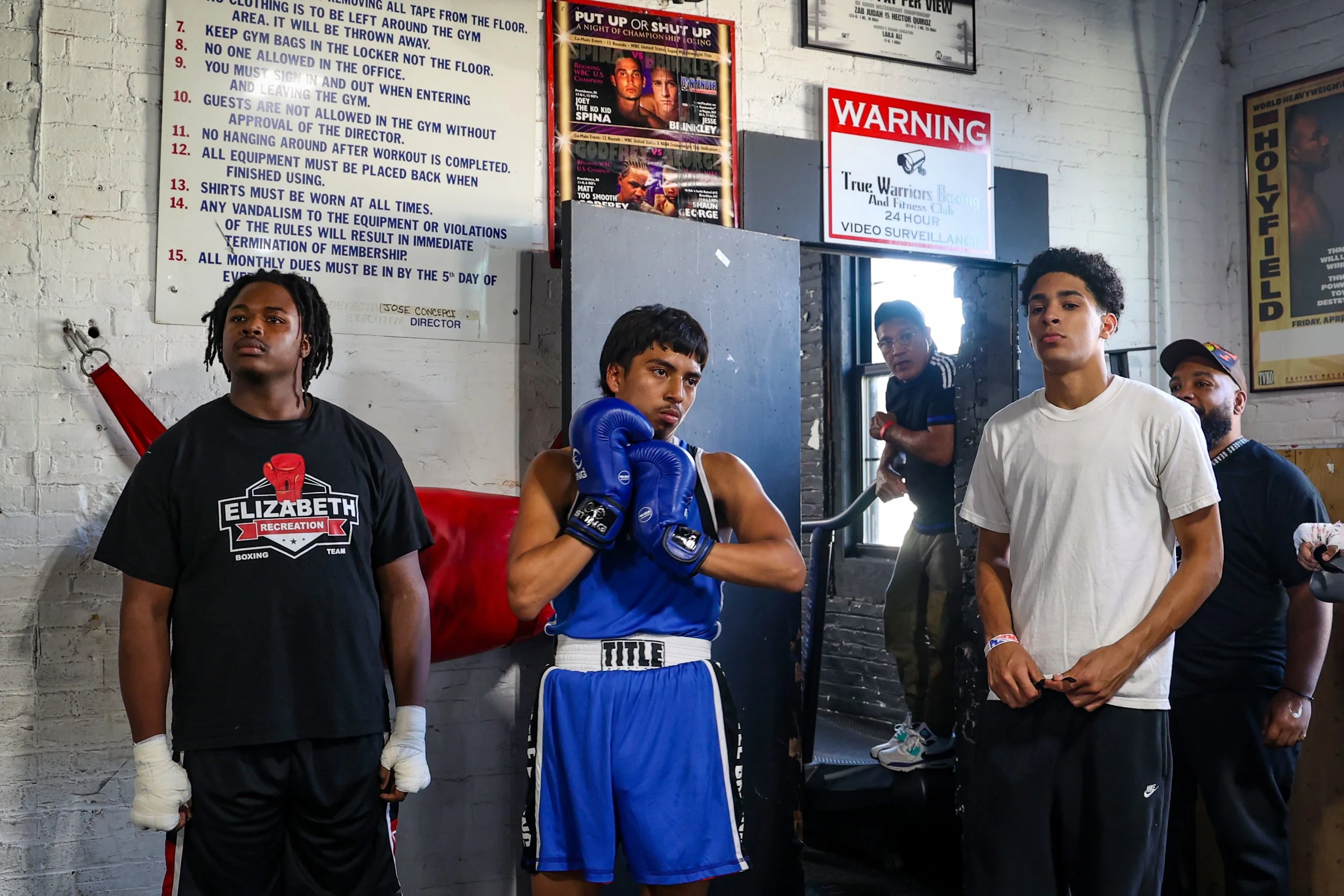 19-year-old boxer Erik Mendez watches a fight while waiting for his fight at the True Warriors Boxing gym in Paterson. 