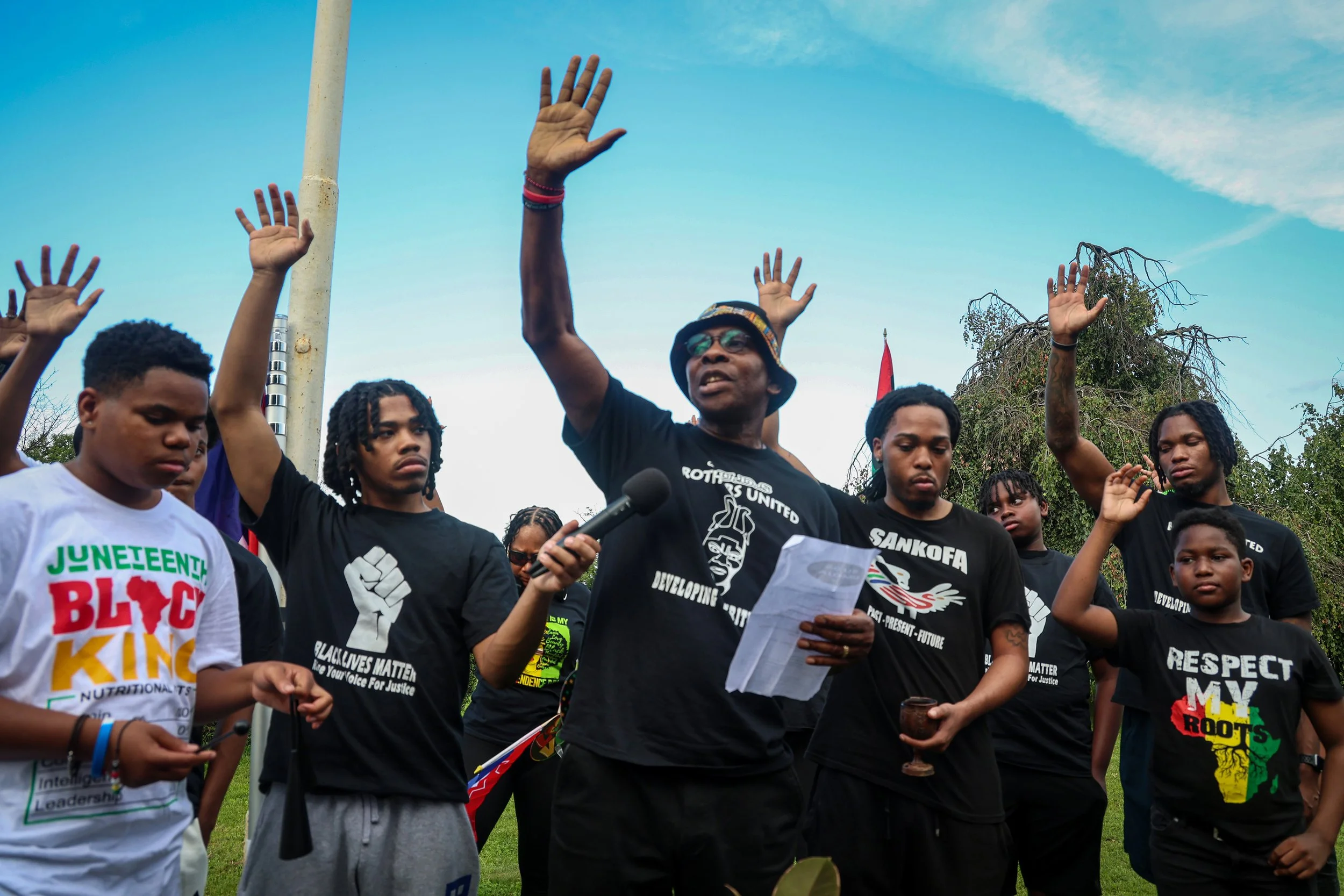PATERSON, N.J. | June 18, 2025: William Raheem Smallwood leads a moment of prayer and remembrance as Paterson’s African American community gathers for its annual Juneteenth Community Flag Raising and Prayer Gathering at Eastside Park. Juneteenth—Eman