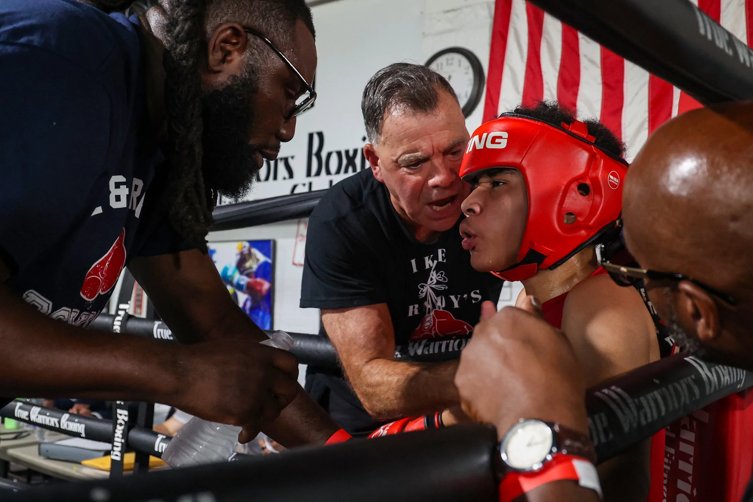 A young boxer from Ike & Randy's gym gets coaching his corner in between rounds at the True Warriors Boxing gym in Paterson. 