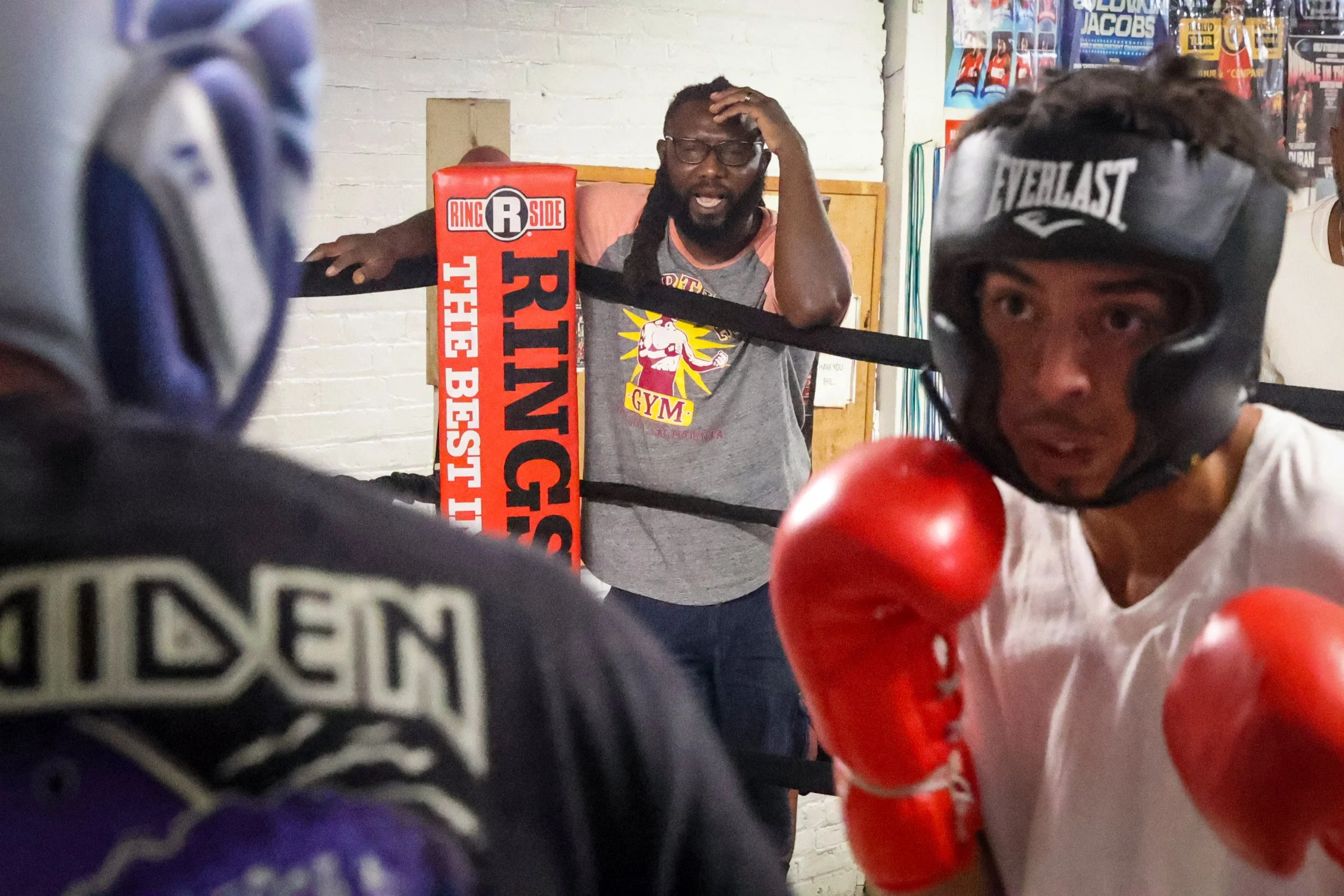 Trainer Ozzie Duran watches as 19-year-old boxer Erik Mendez spars with Ramon Ordonez 