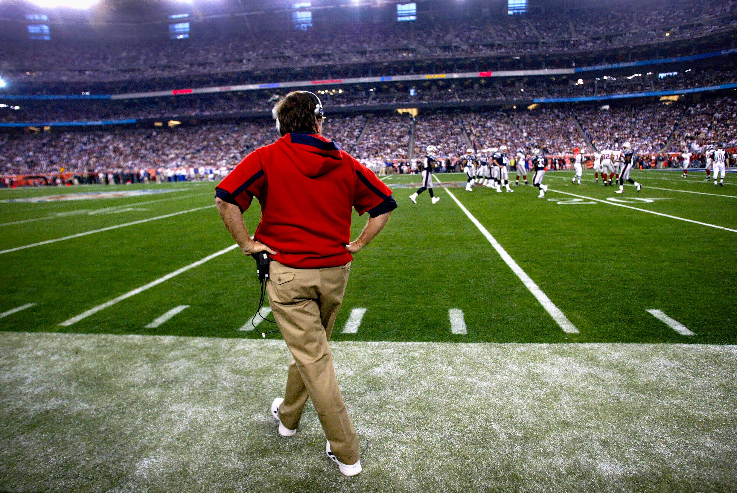 Patriots head coach Bill Belichick walks the sidelines