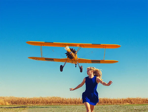 Girl-running-from-plane.jpeg